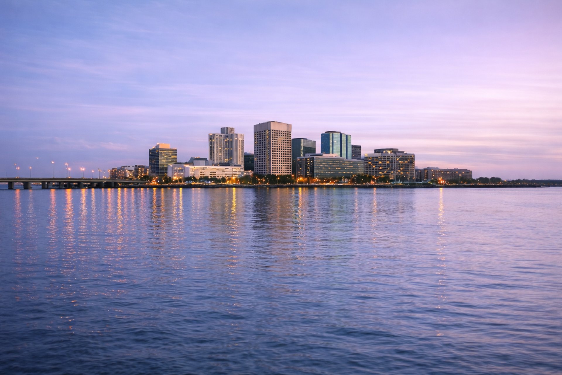 an abstract photo of a curved building with a blue sky in the background