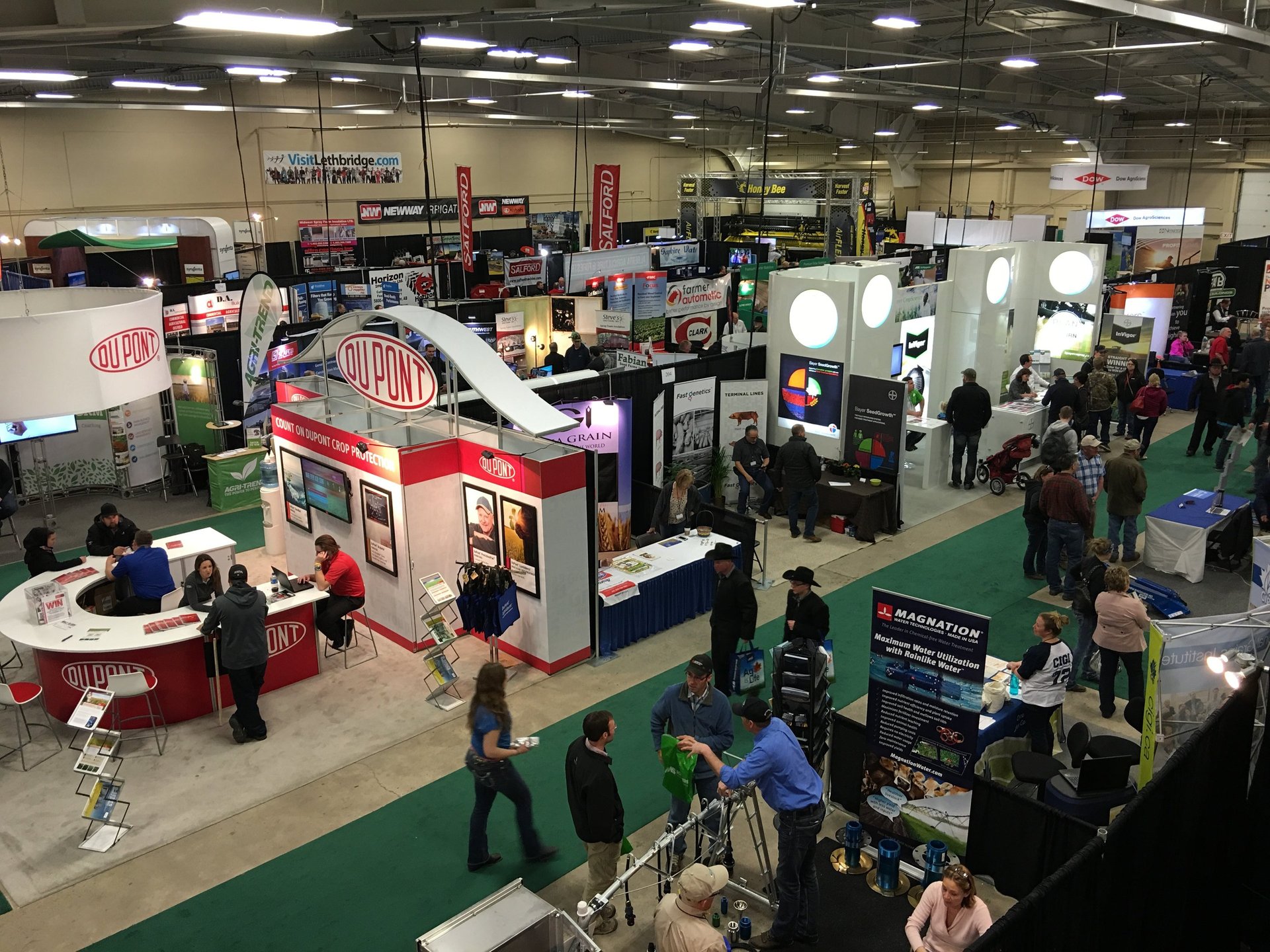 a boat hanging from the side of a green building
