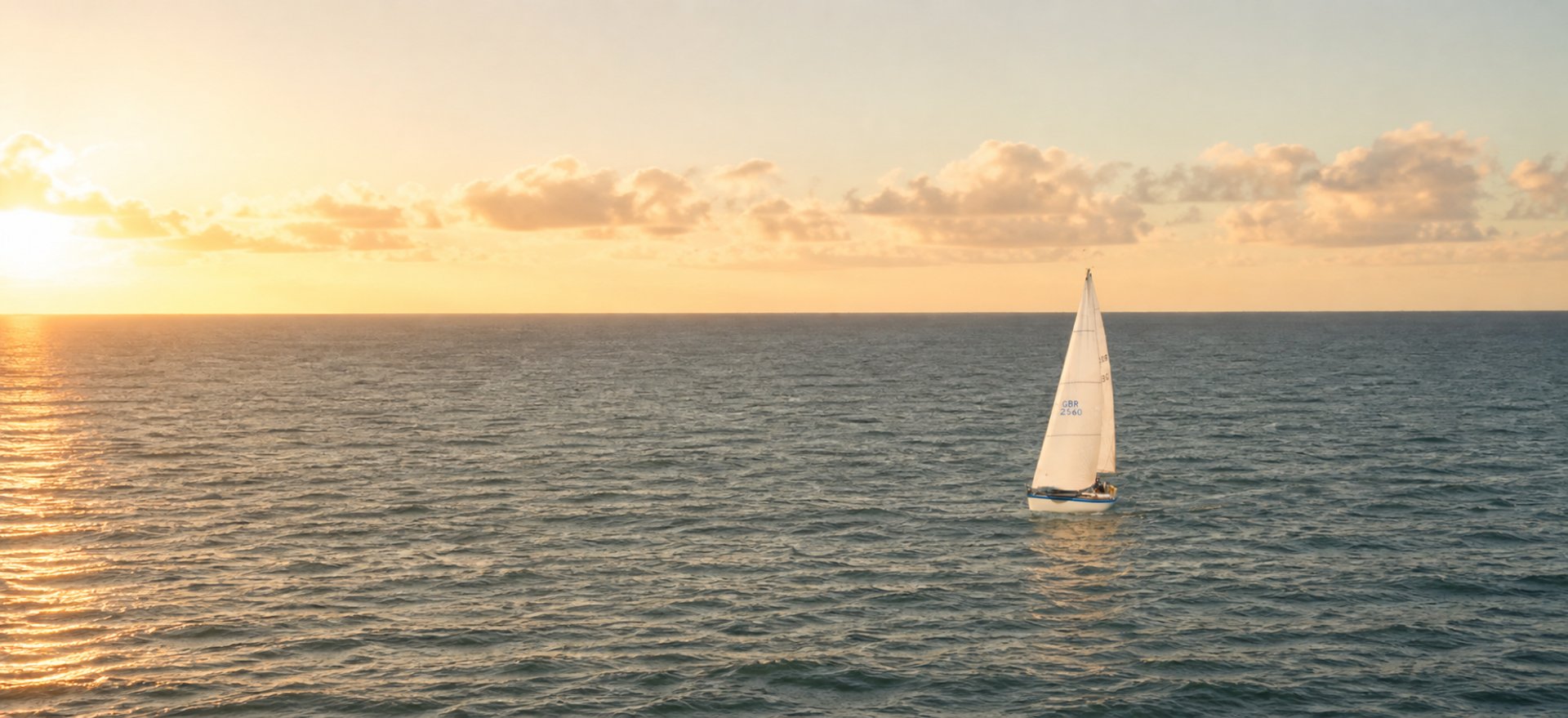 white sailboat in body of water during daytime