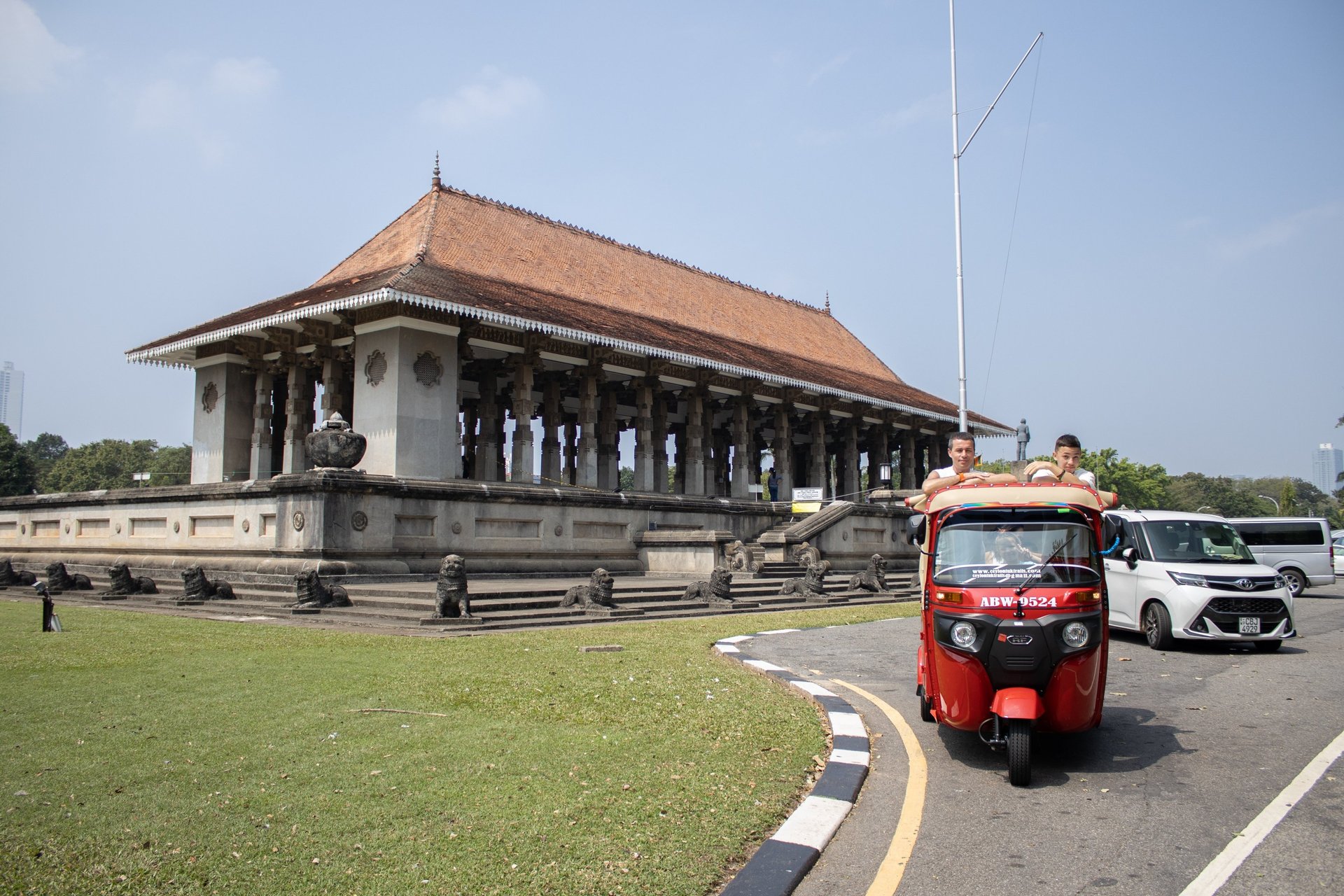 a man driving a bus down a street at night