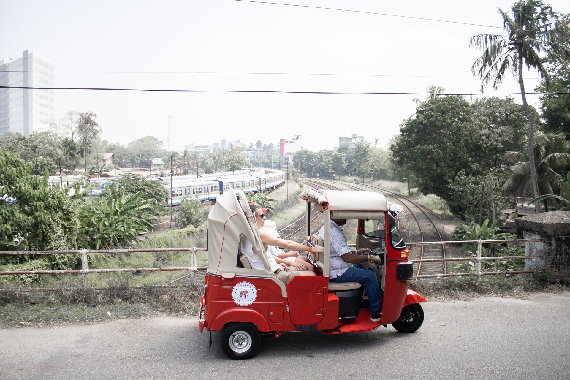 a man driving a bus down a street at night