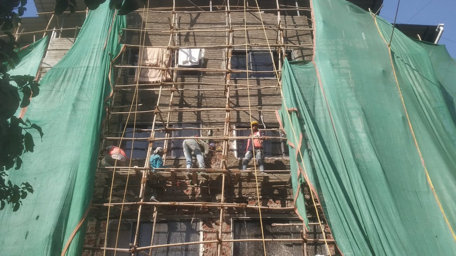 woman wearing yellow long-sleeved dress under white clouds and blue sky during daytime