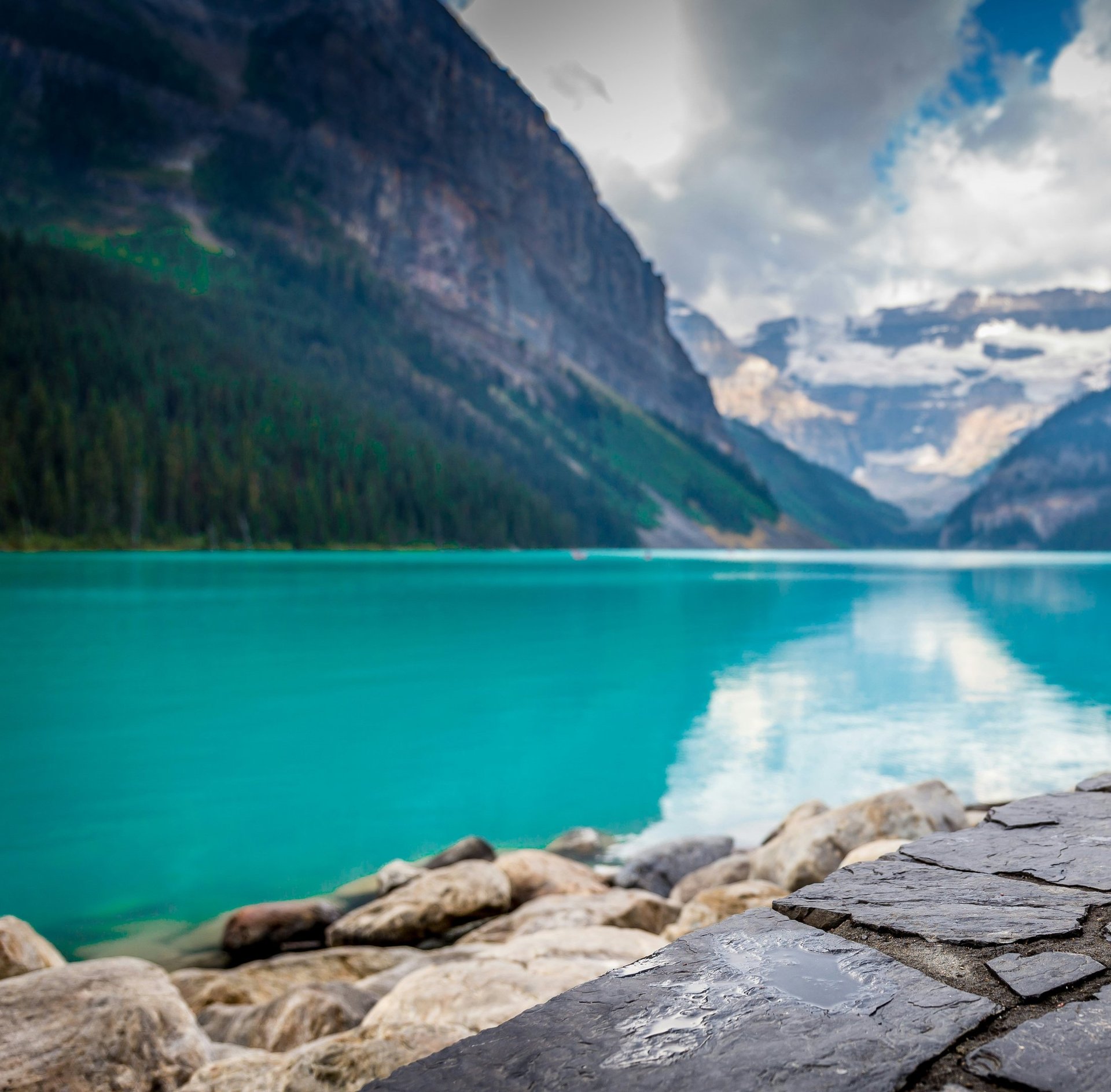 woman wearing yellow long-sleeved dress under white clouds and blue sky during daytime