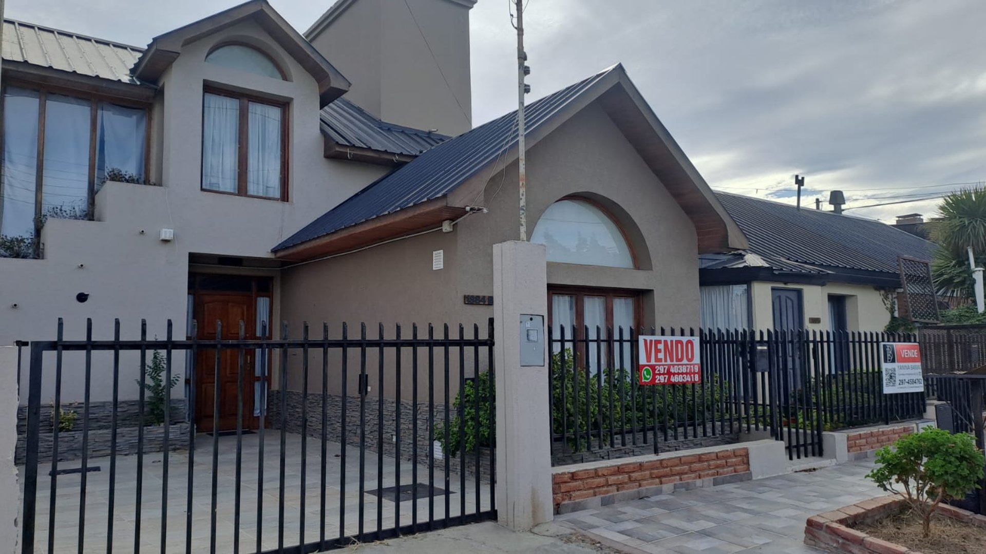 black and brown leather padded tub sofa