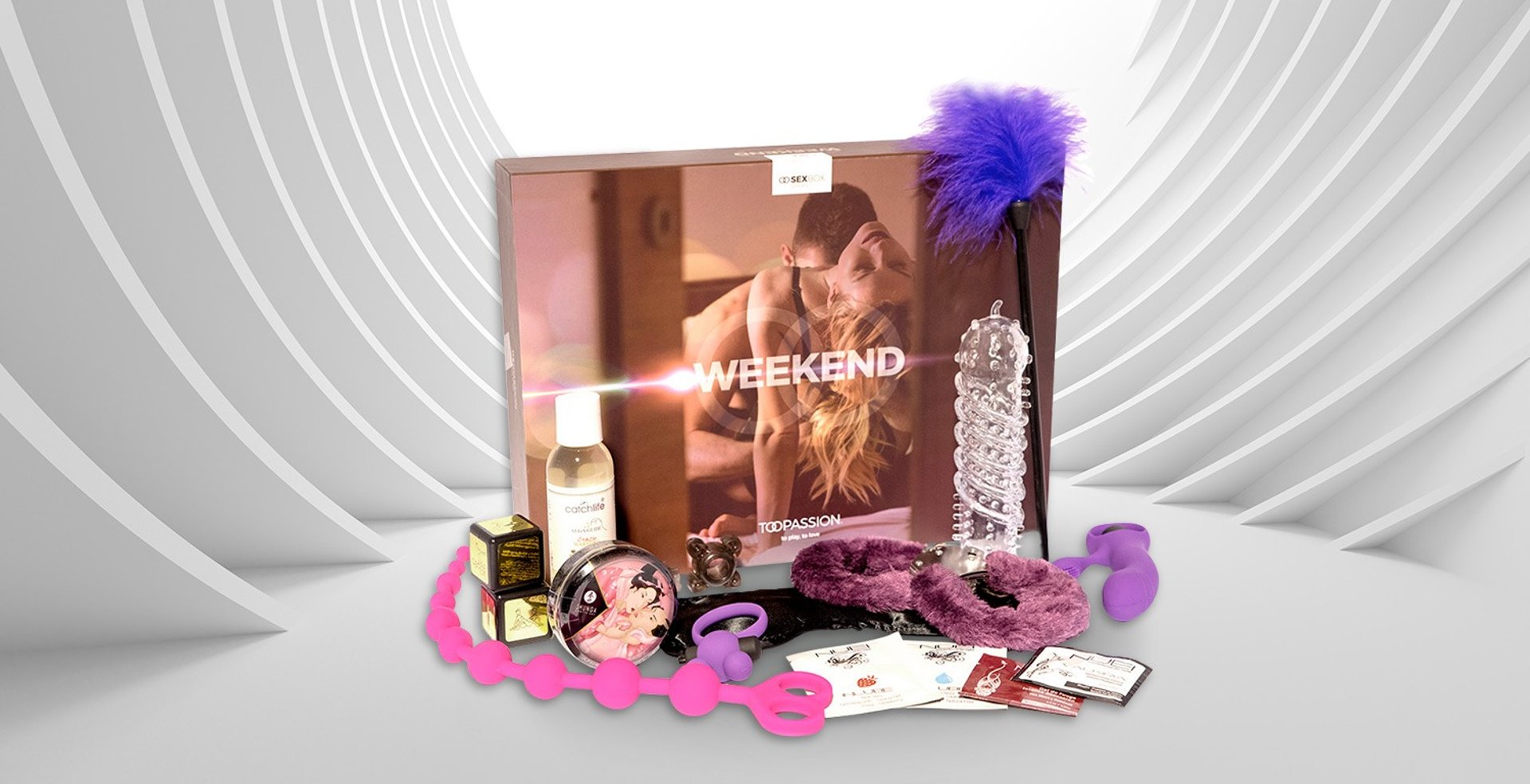 a woman lying on a bed with a red object in her hand