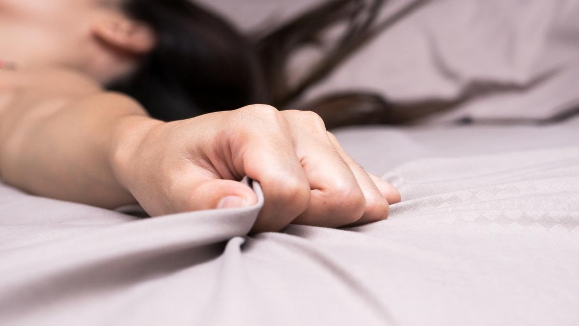 woman wearing yellow long-sleeved dress under white clouds and blue sky during daytime