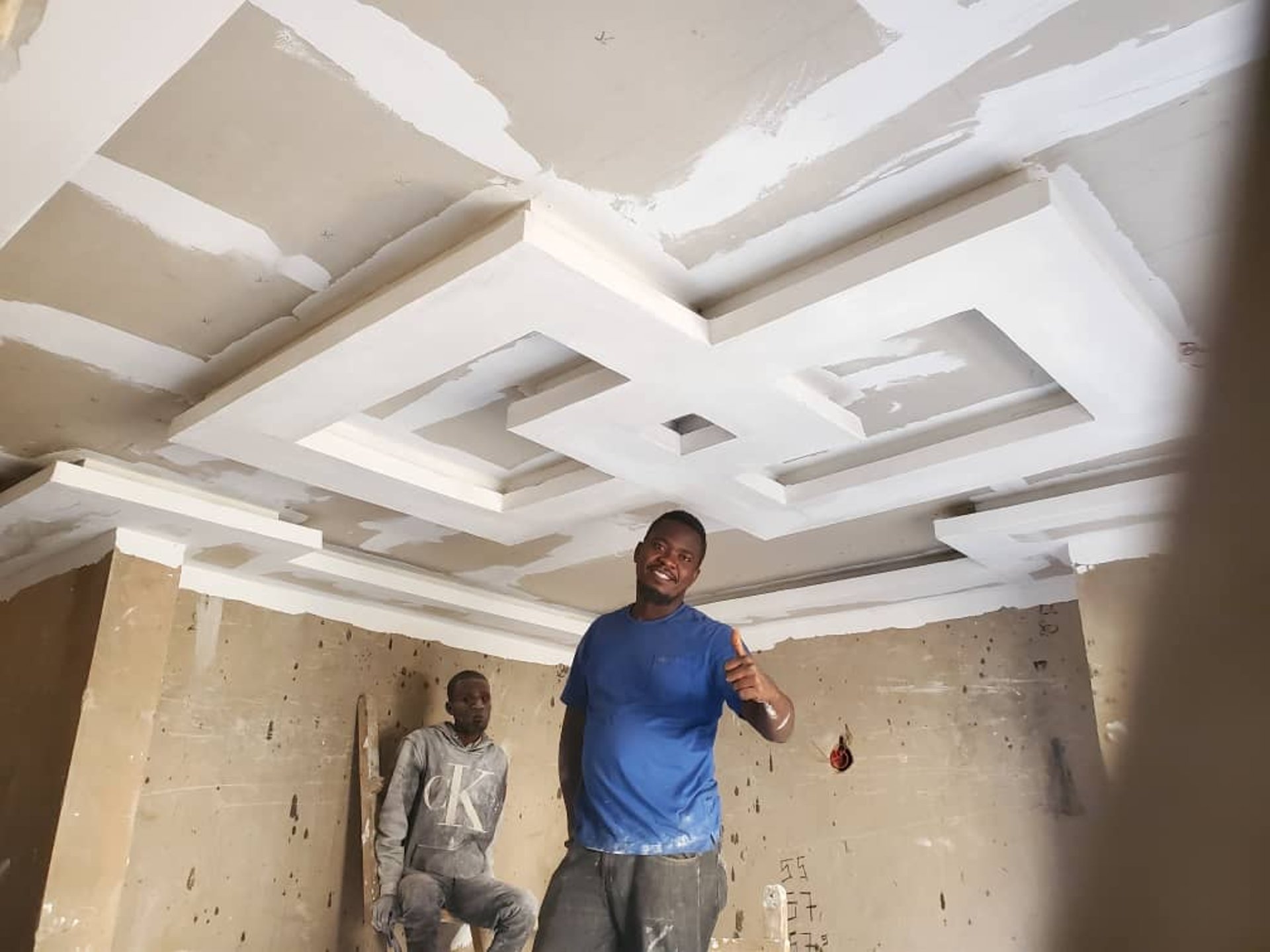 an abstract photo of a curved building with a blue sky in the background