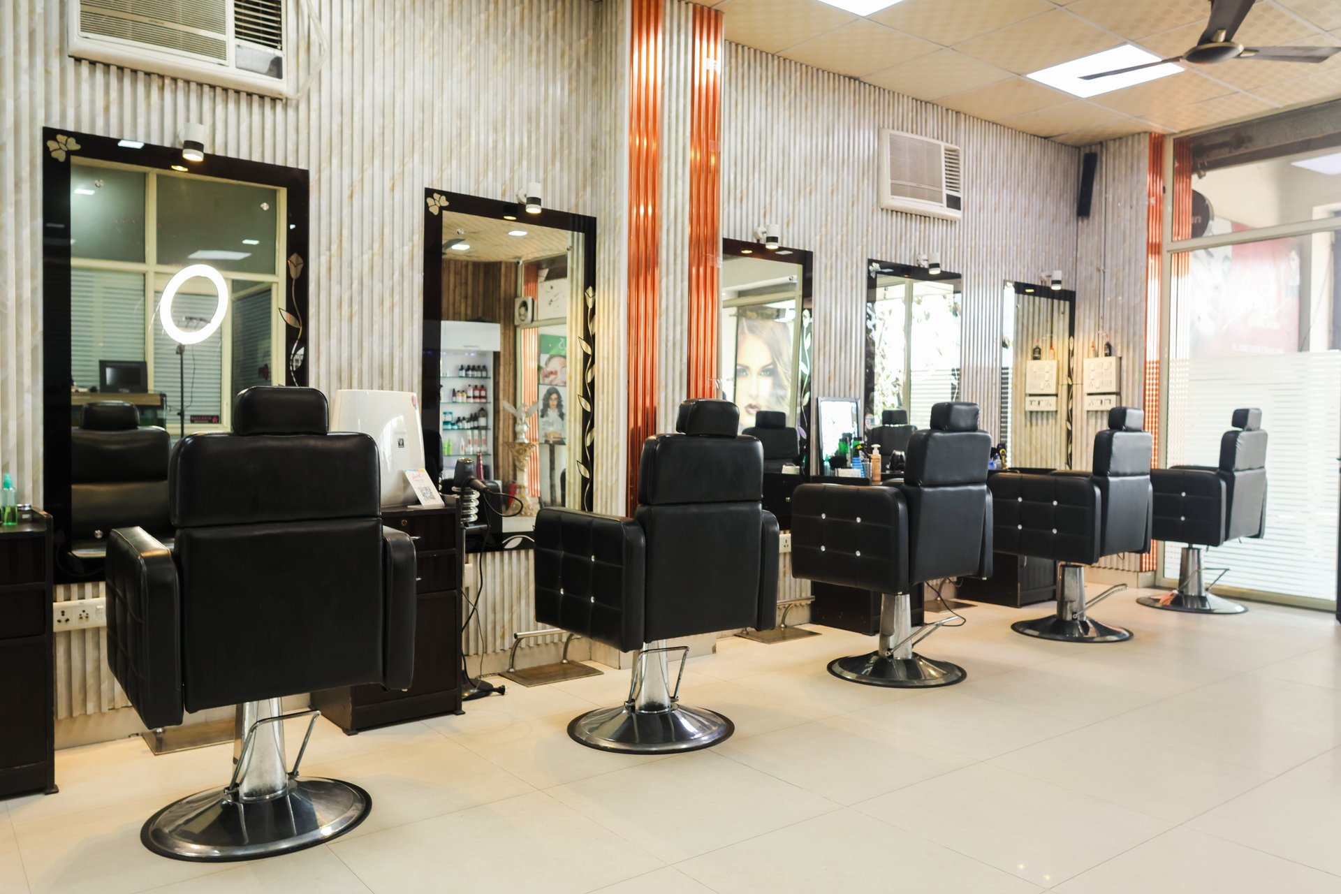 woman in red long sleeve shirt holding hair blower
