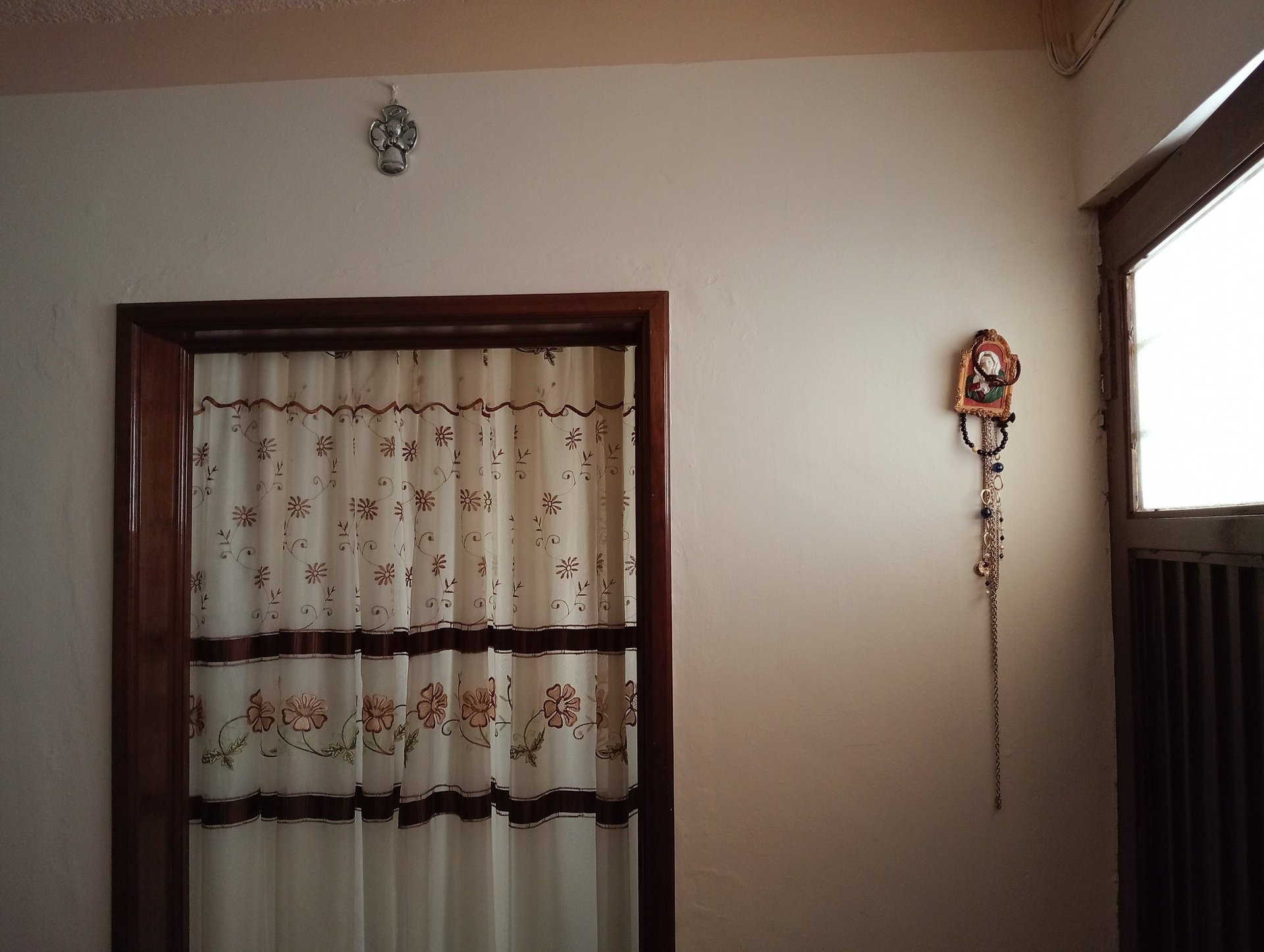 an abstract photo of a curved building with a blue sky in the background
