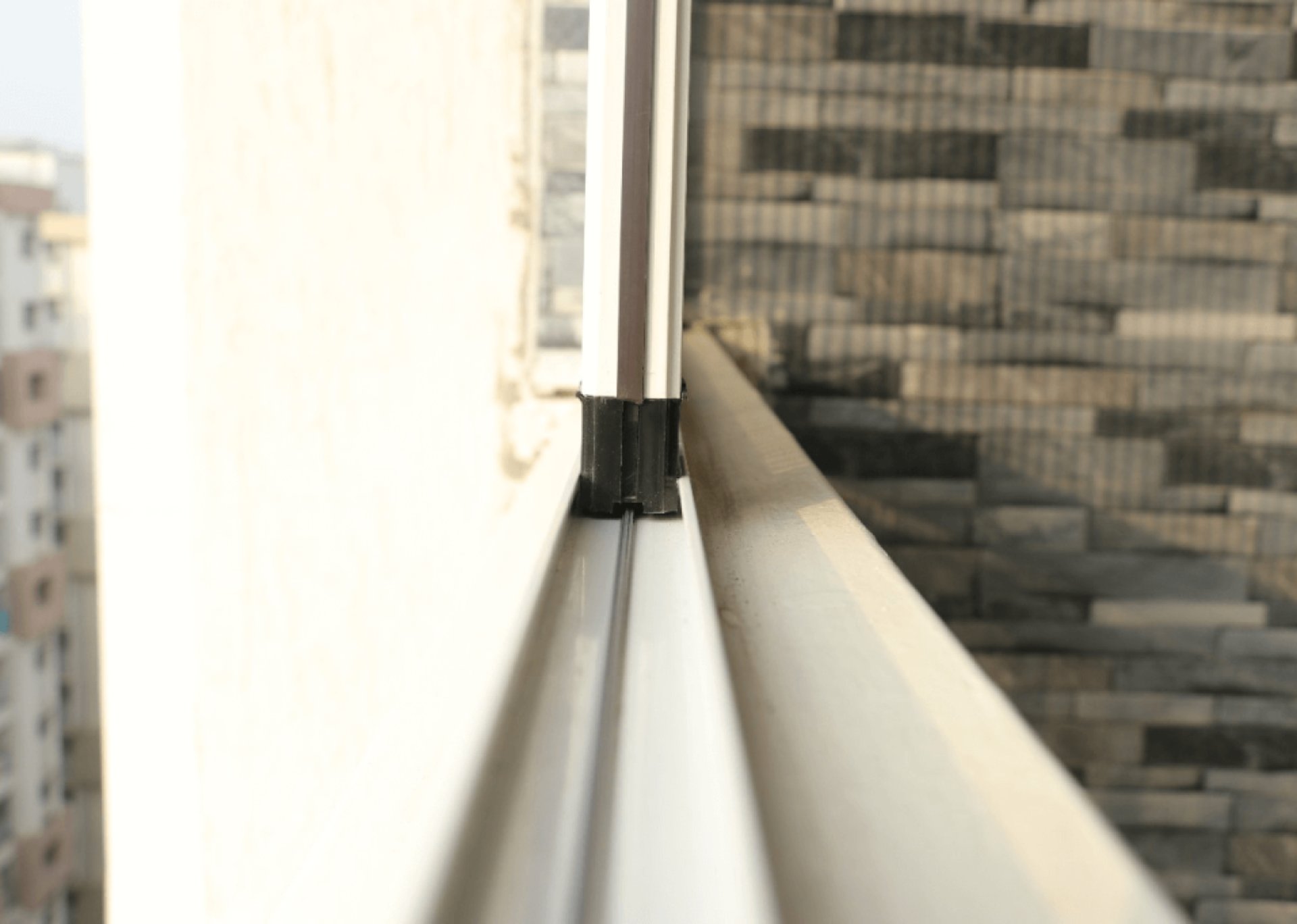 an abstract photo of a curved building with a blue sky in the background