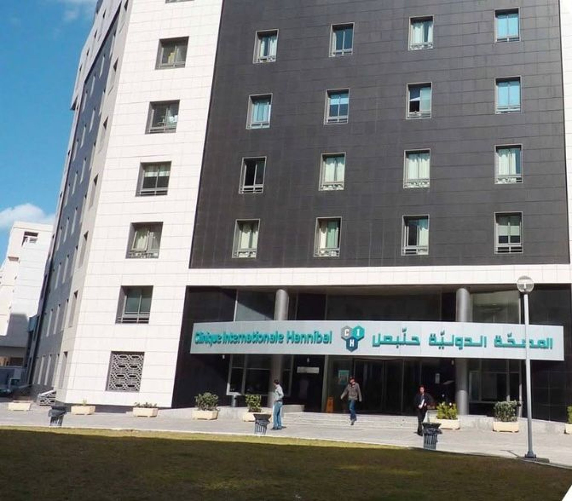 woman wearing yellow long-sleeved dress under white clouds and blue sky during daytime