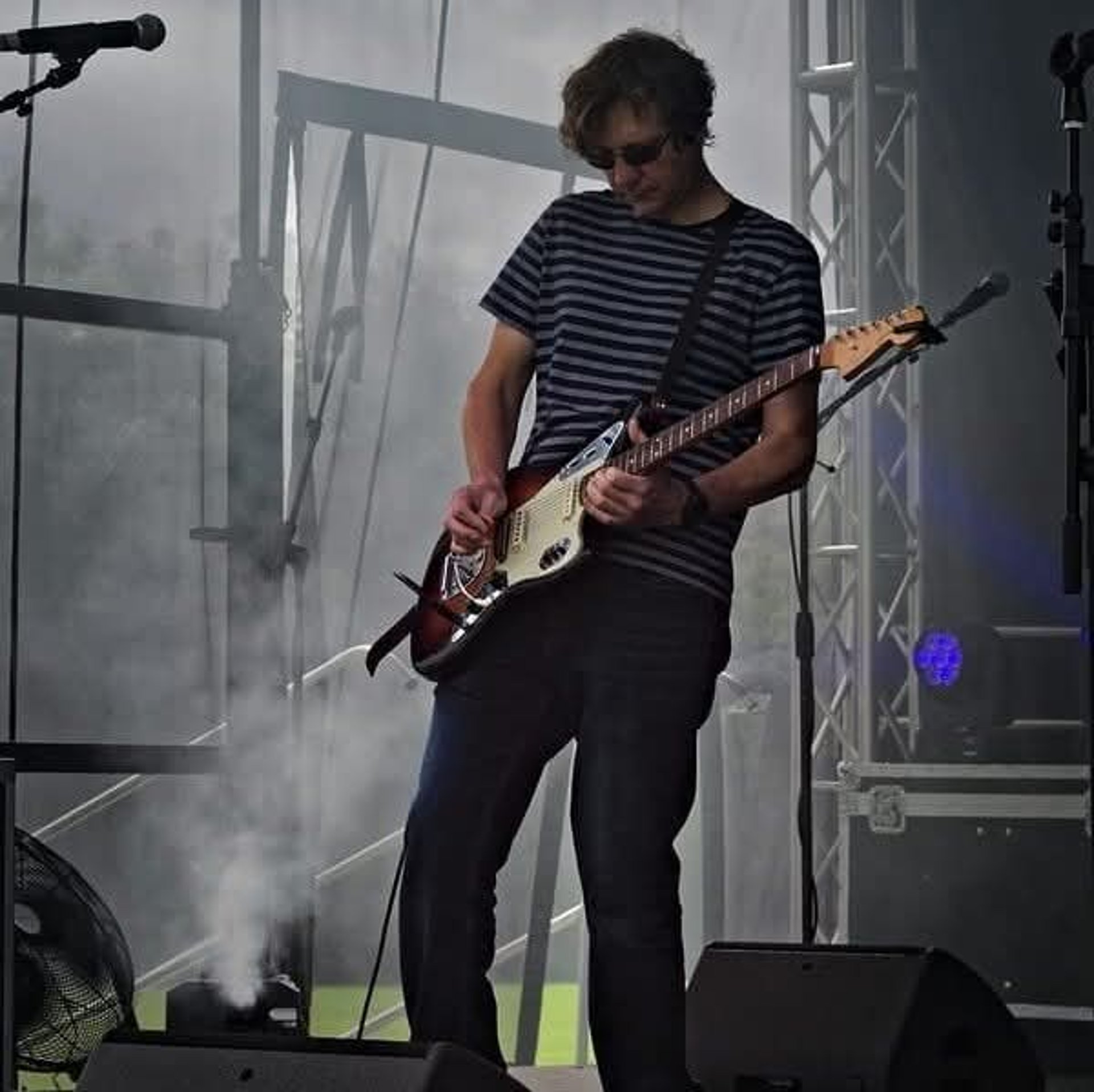 woman wearing yellow long-sleeved dress under white clouds and blue sky during daytime