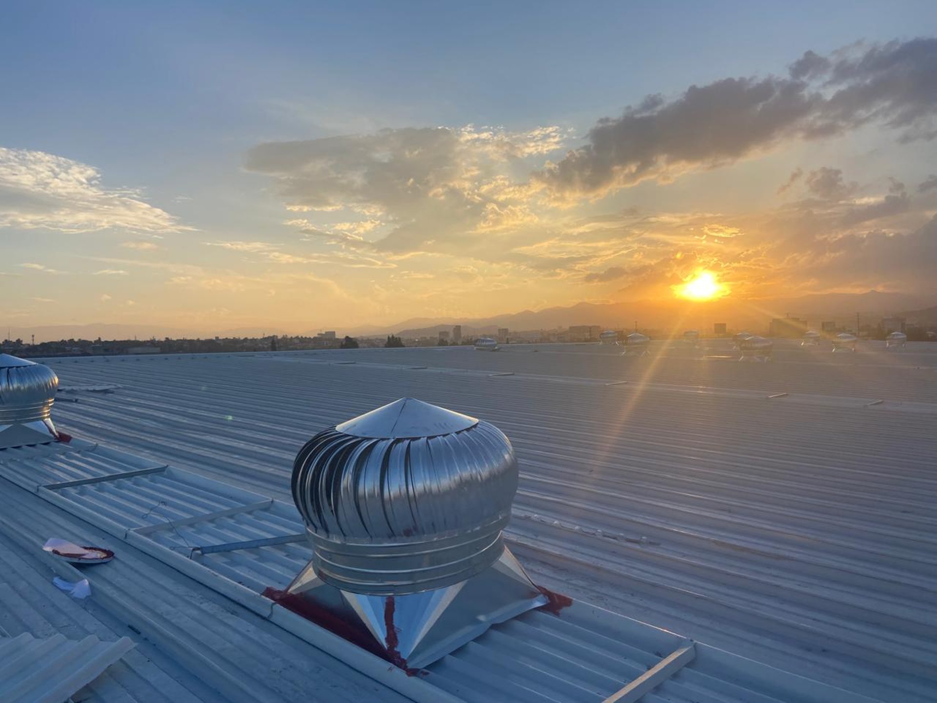 woman wearing yellow long-sleeved dress under white clouds and blue sky during daytime