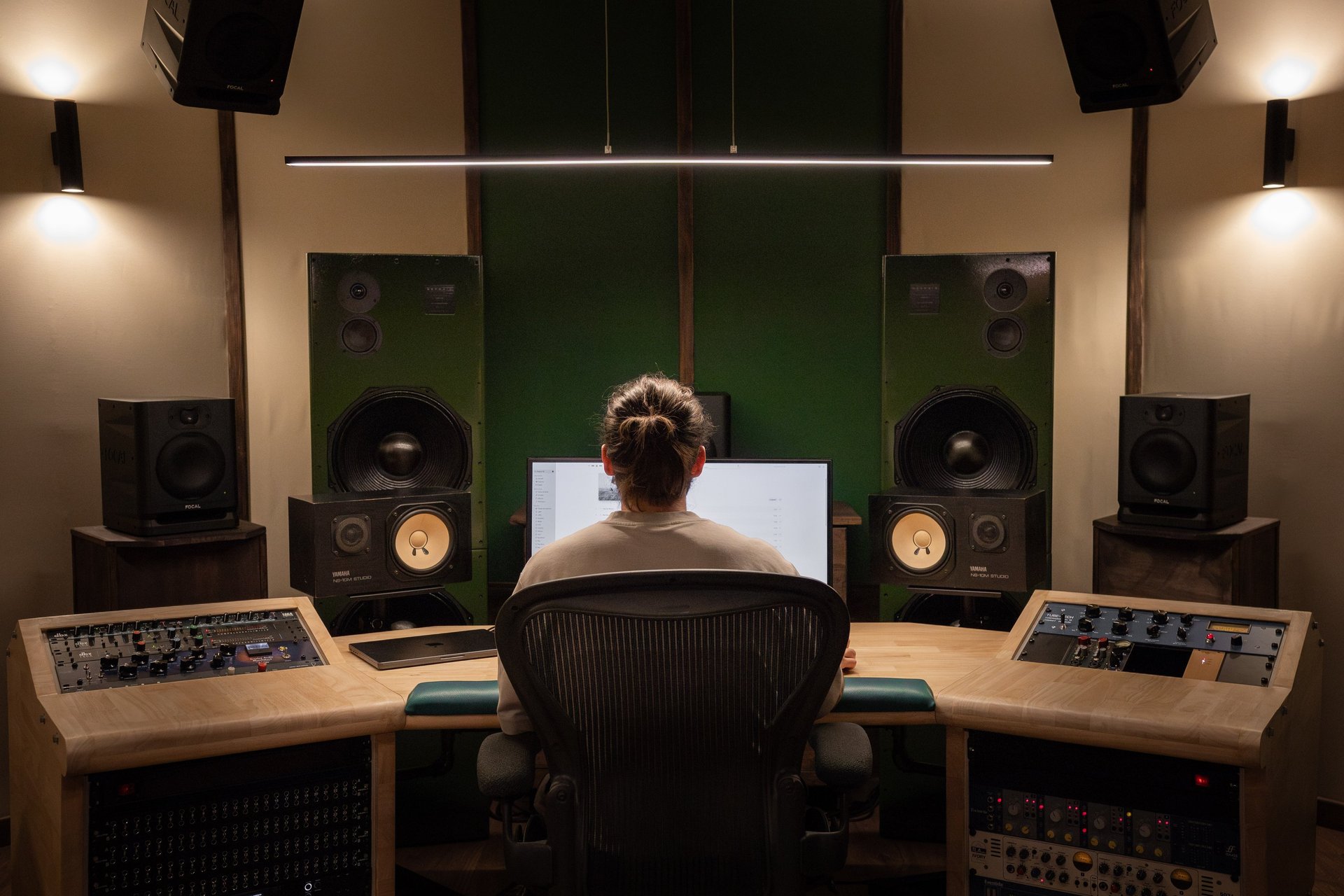 an abstract photo of a curved building with a blue sky in the background