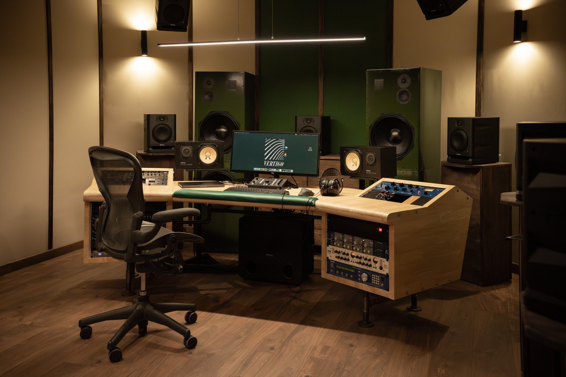 an abstract photo of a curved building with a blue sky in the background