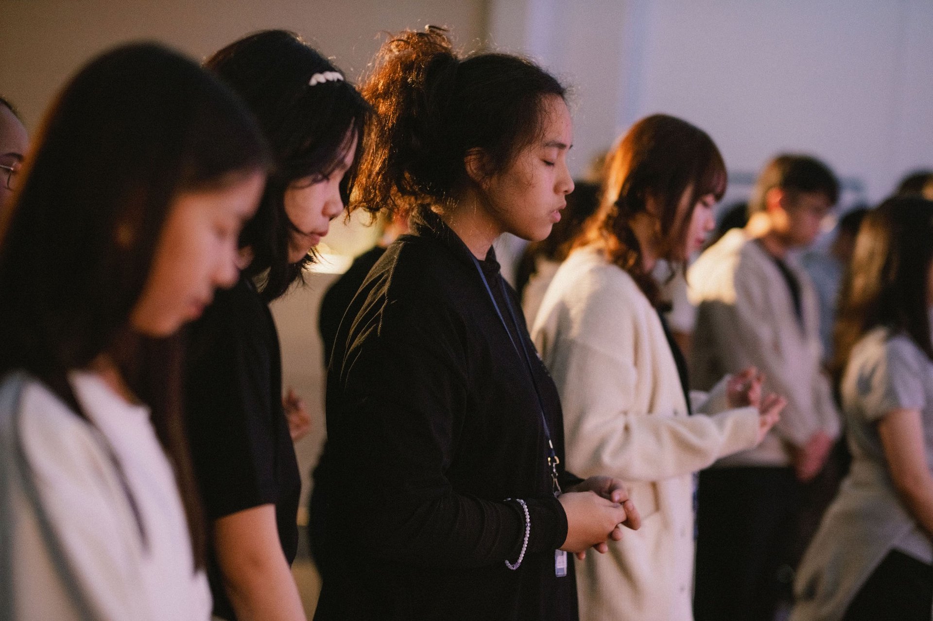 an abstract photo of a curved building with a blue sky in the background