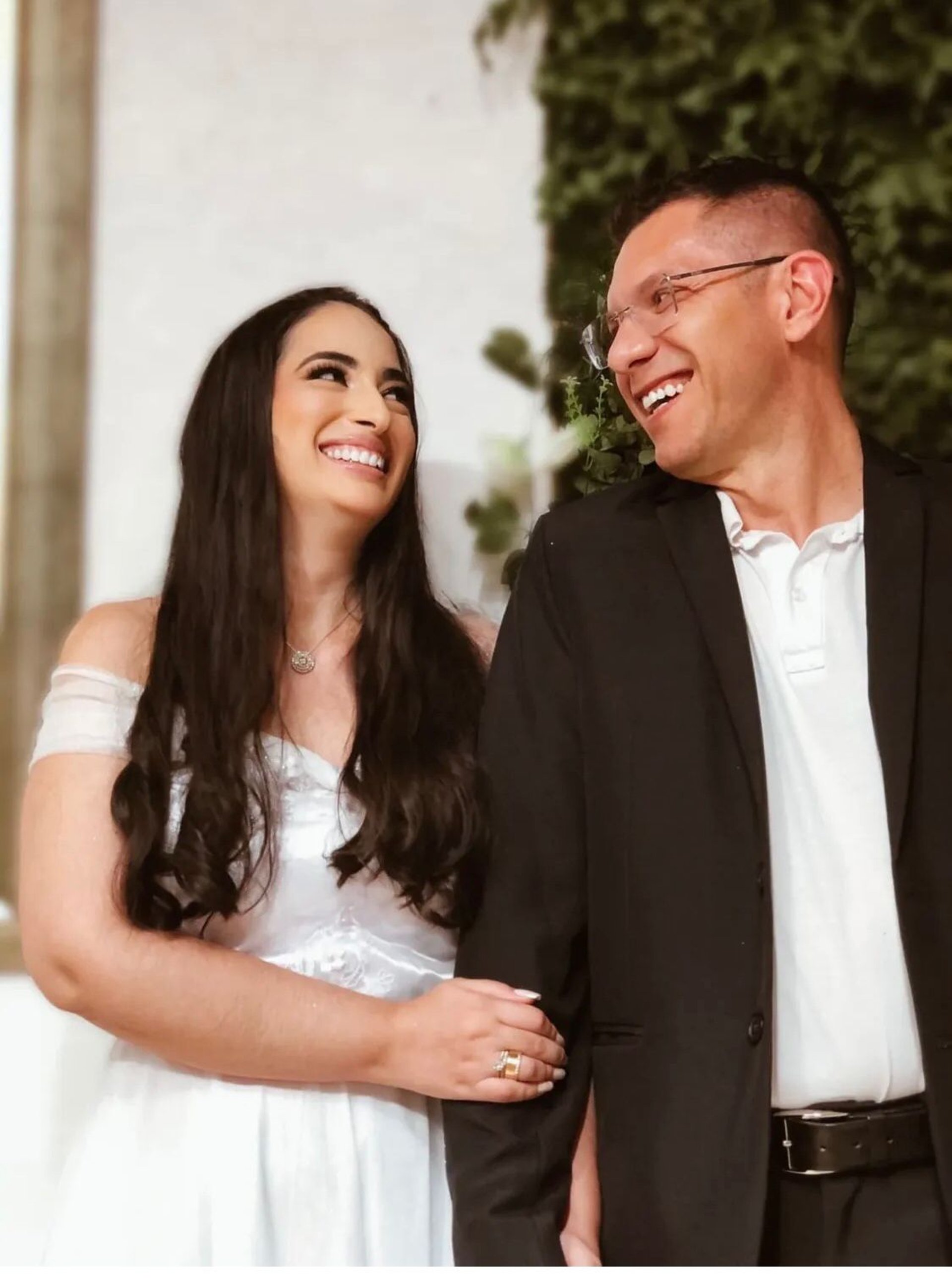 couple wearing silver-colored rings