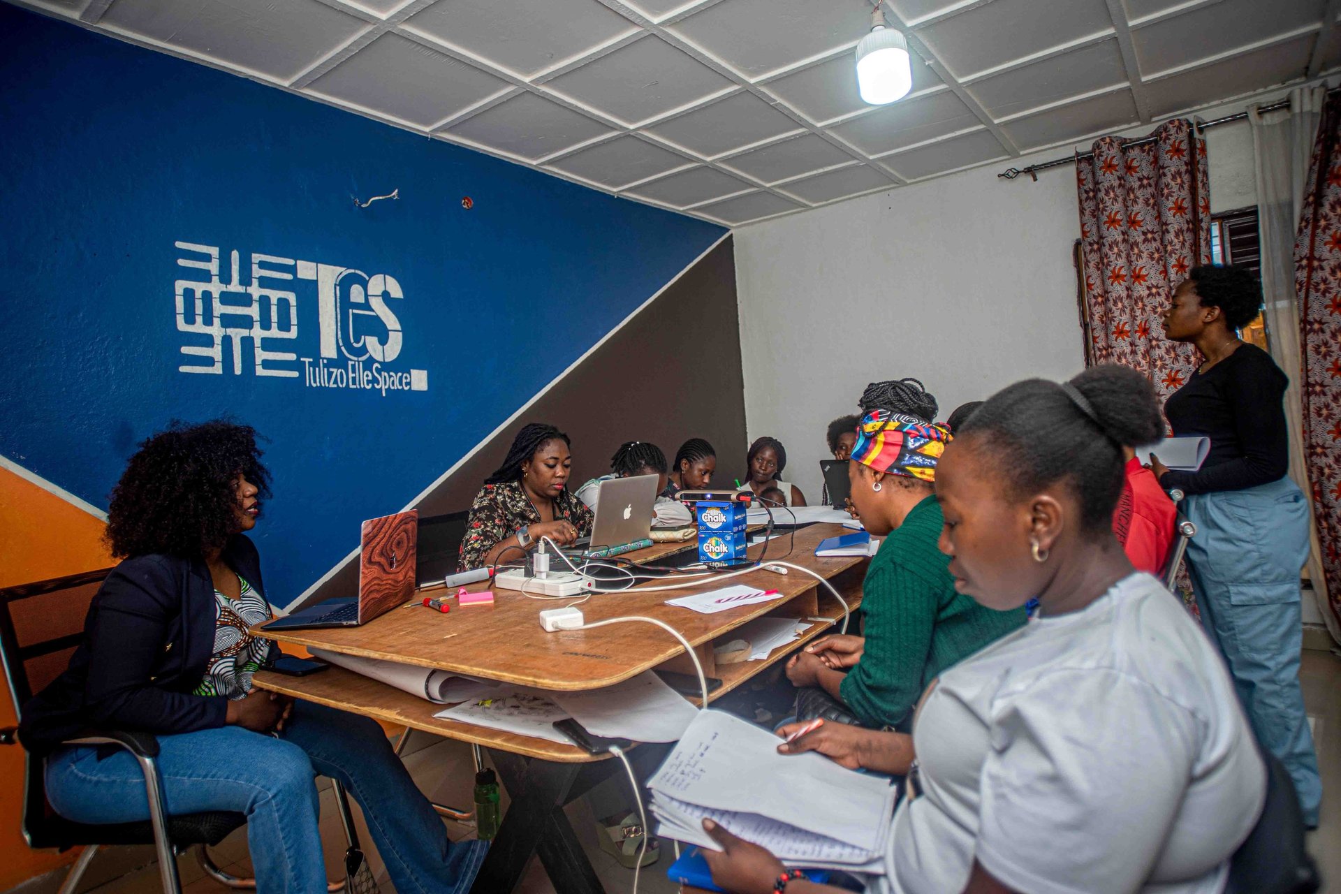 an abstract photo of a curved building with a blue sky in the background