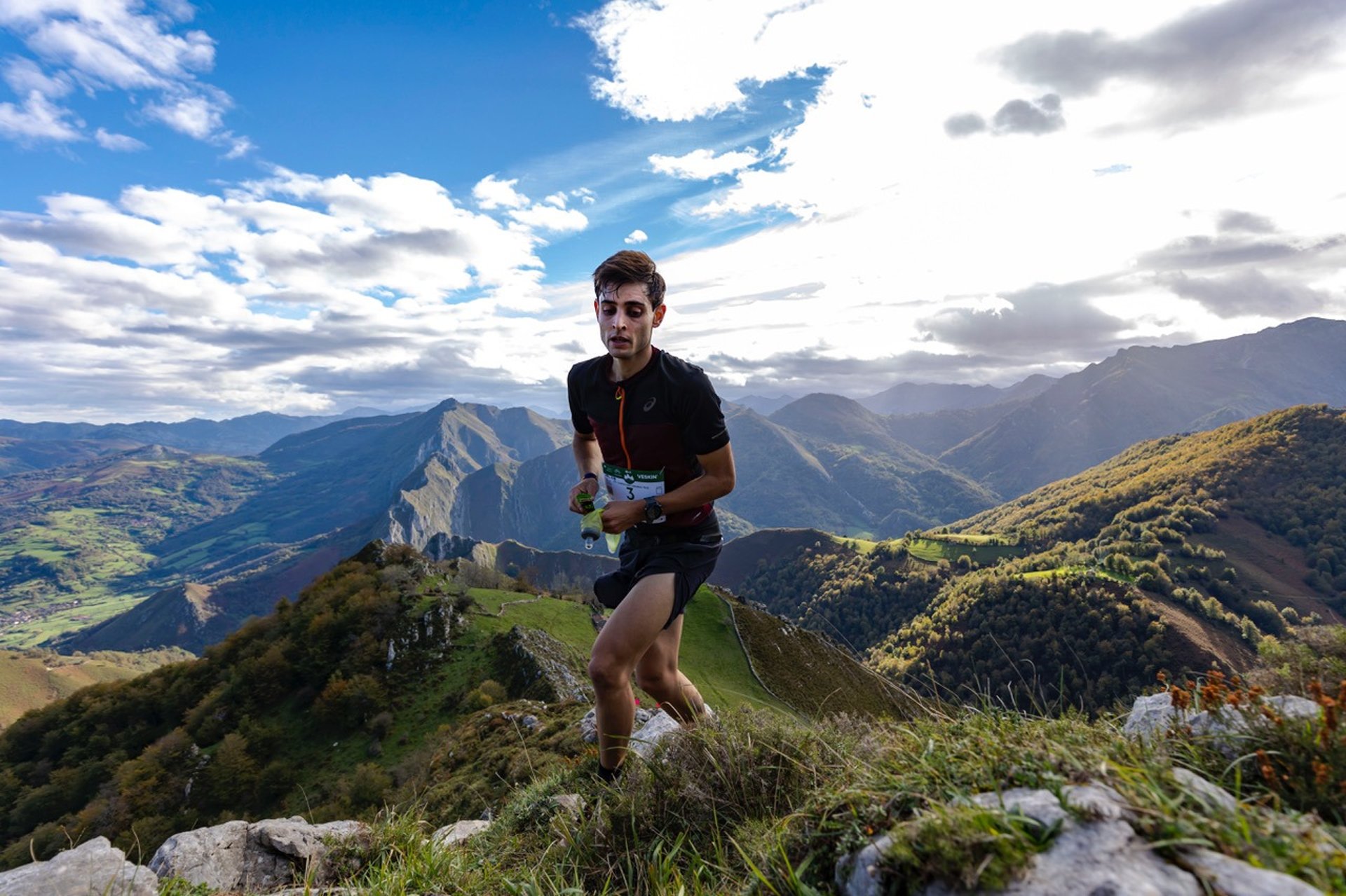 an abstract photo of a curved building with a blue sky in the background