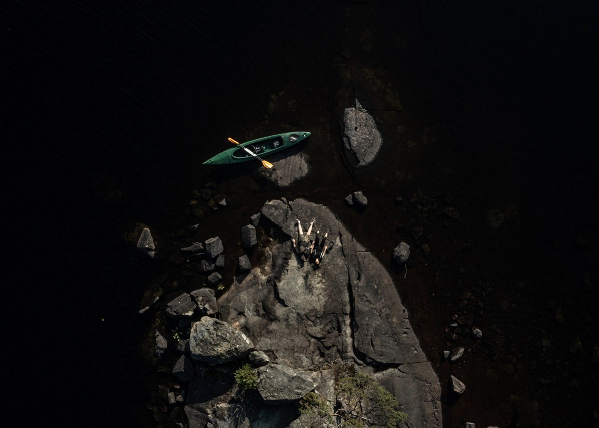 a close up of a black and brown abstract painting