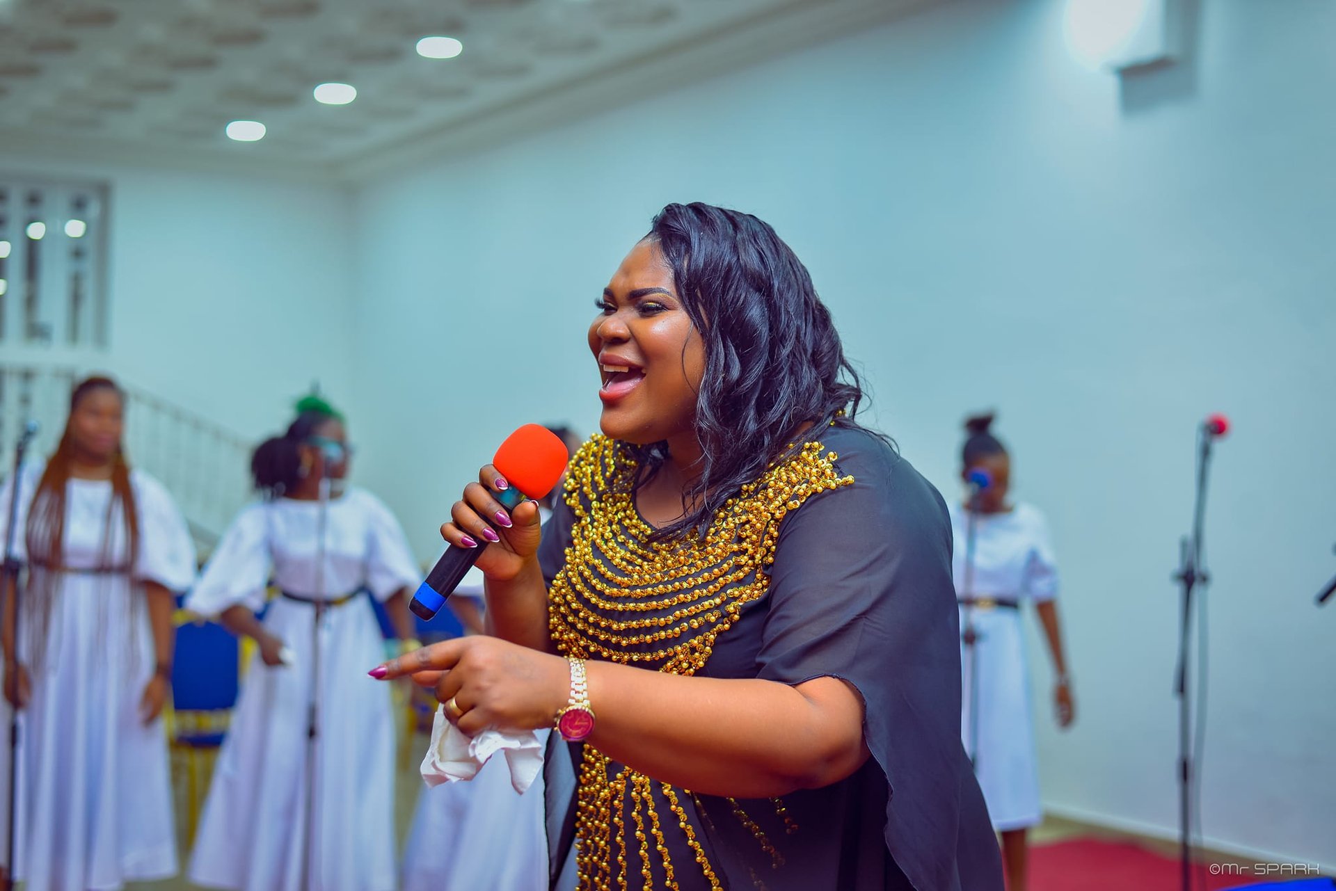 selective focus photography of woman raising left hand