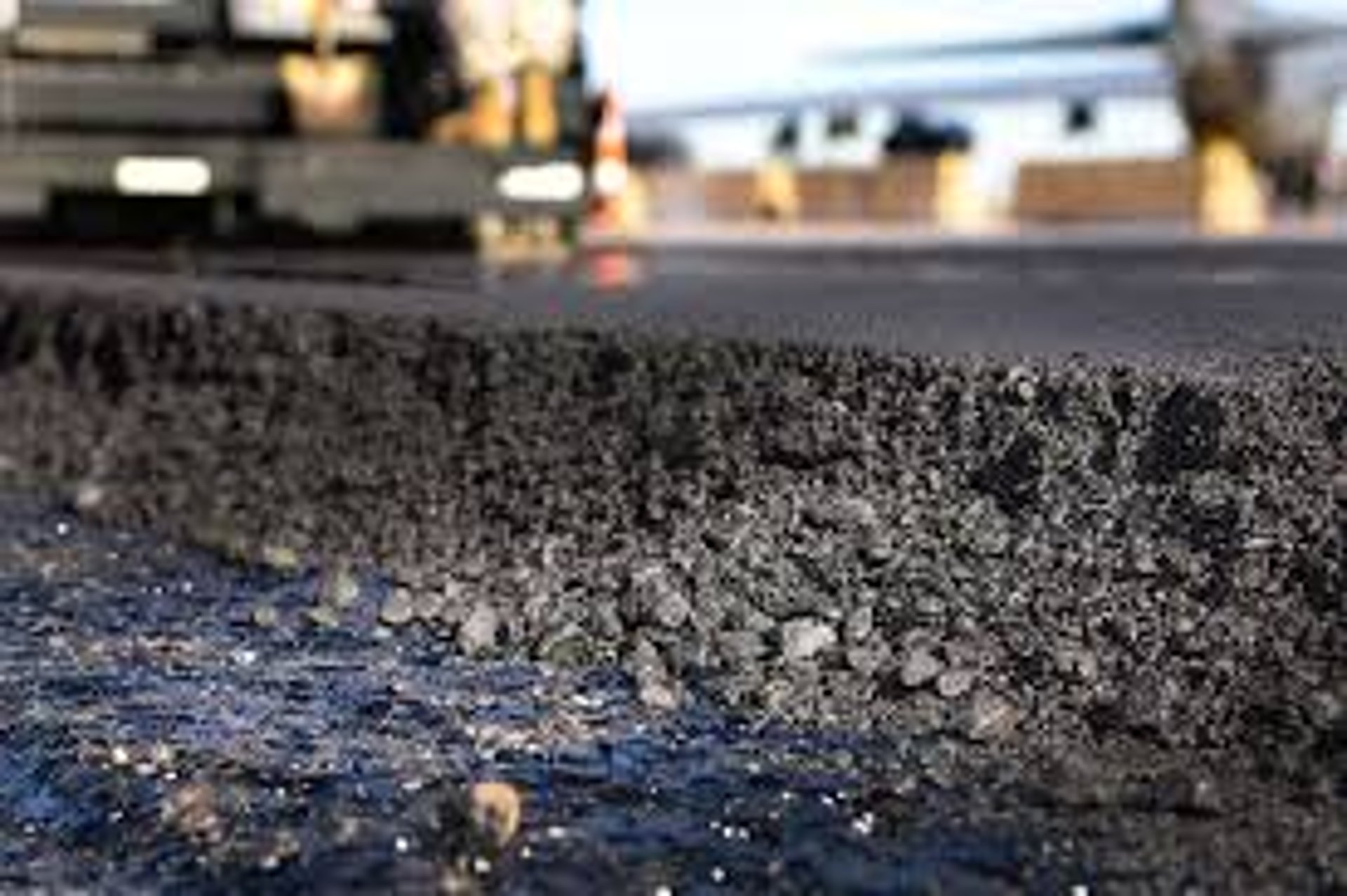 a crack in a concrete wall with a white line going through it