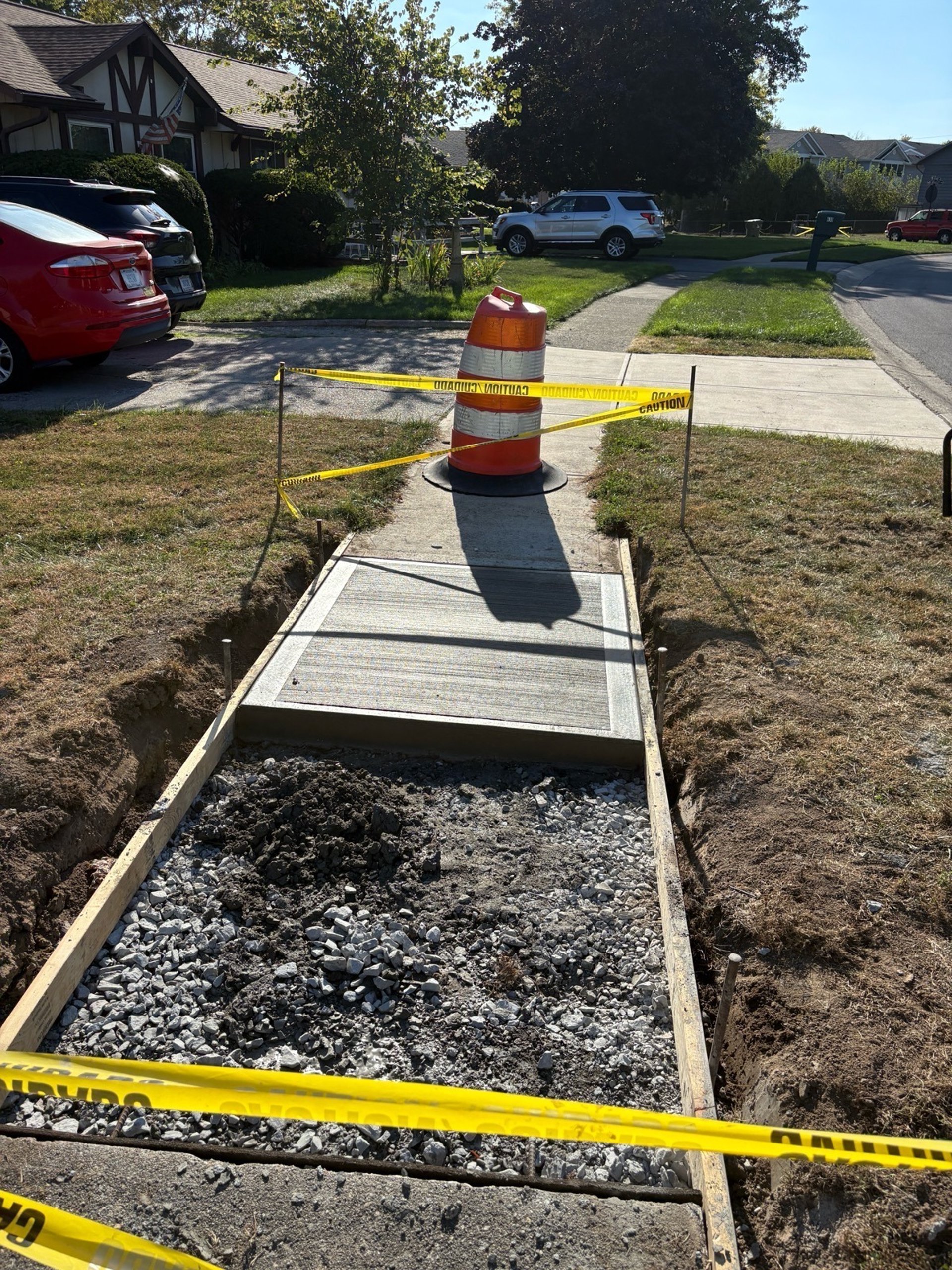 a crack in a concrete wall with a white line going through it