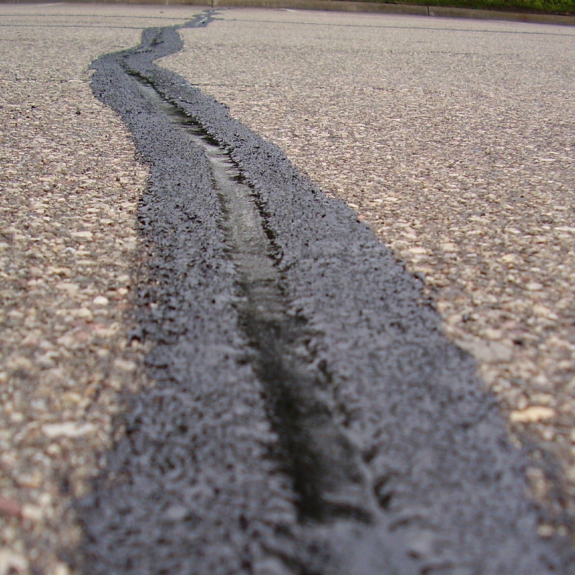 black and yellow line on gray concrete pavement