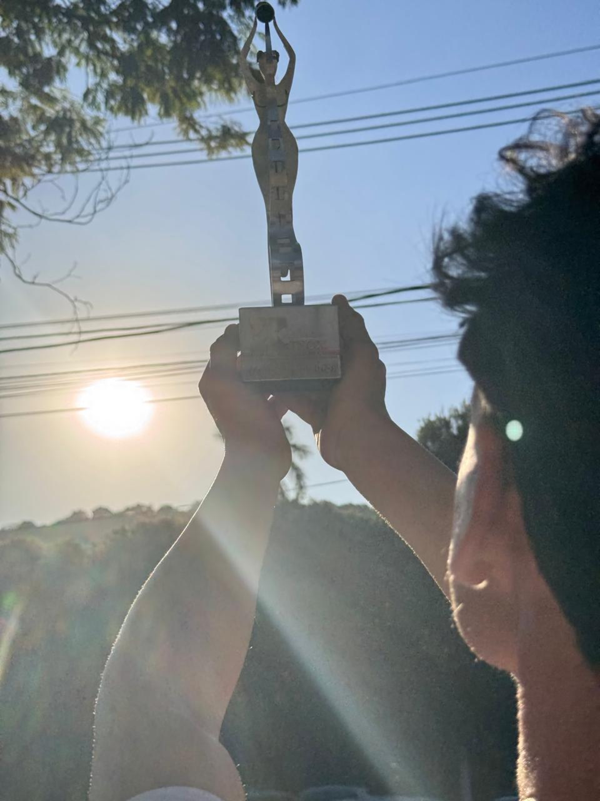 woman wearing yellow long-sleeved dress under white clouds and blue sky during daytime