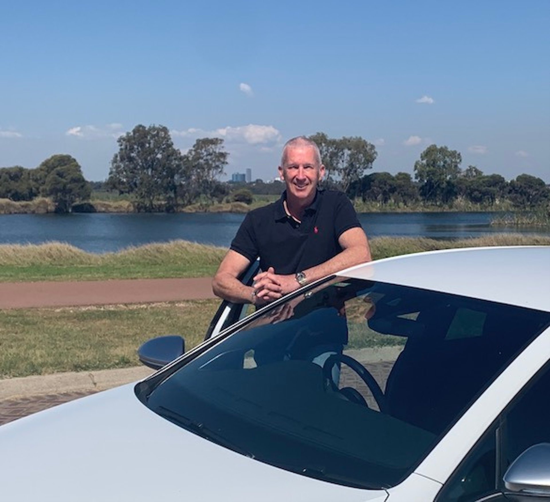 woman wearing yellow long-sleeved dress under white clouds and blue sky during daytime
