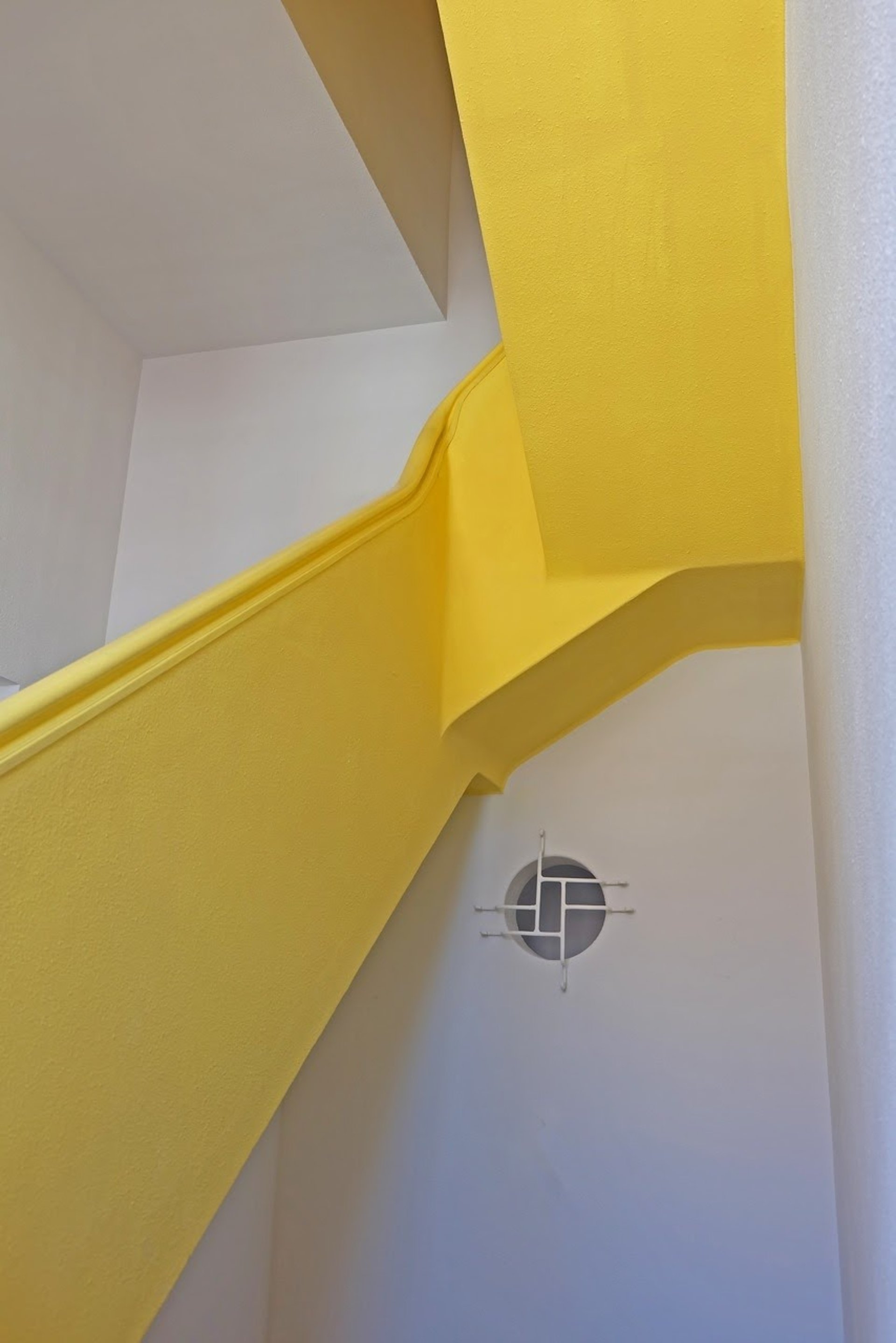 man in black jacket sitting beside black flat screen computer monitor