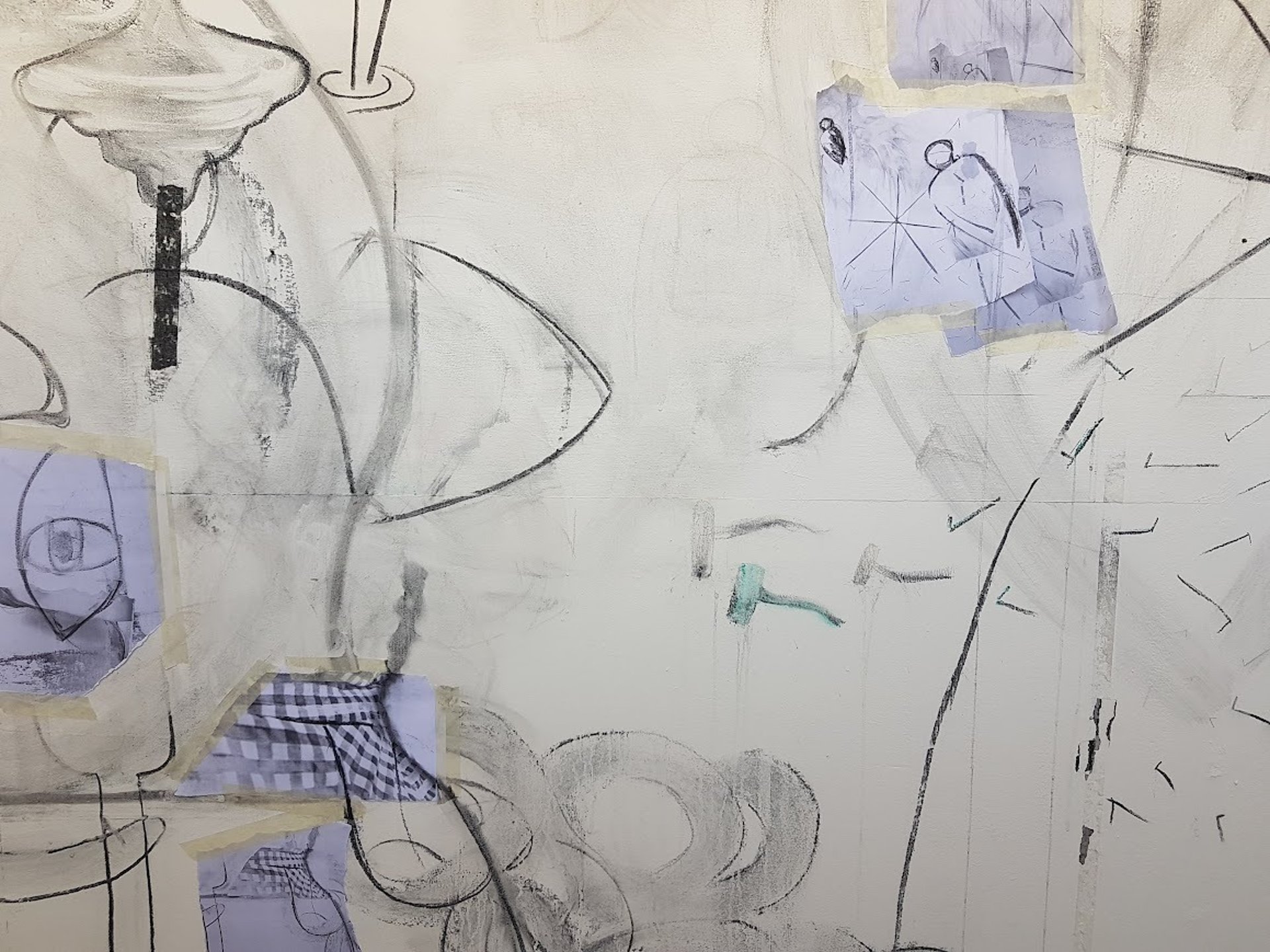 Misty forest path with bare trees and fallen leaves.