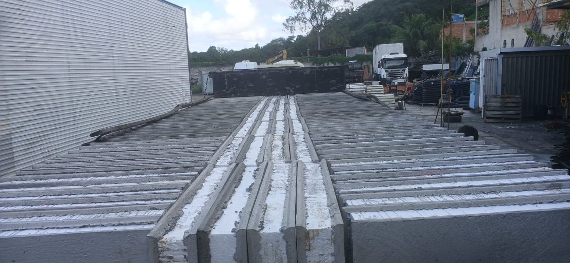 an abstract photo of a curved building with a blue sky in the background