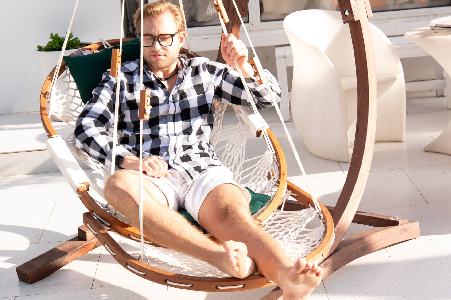 an abstract photo of a curved building with a blue sky in the background