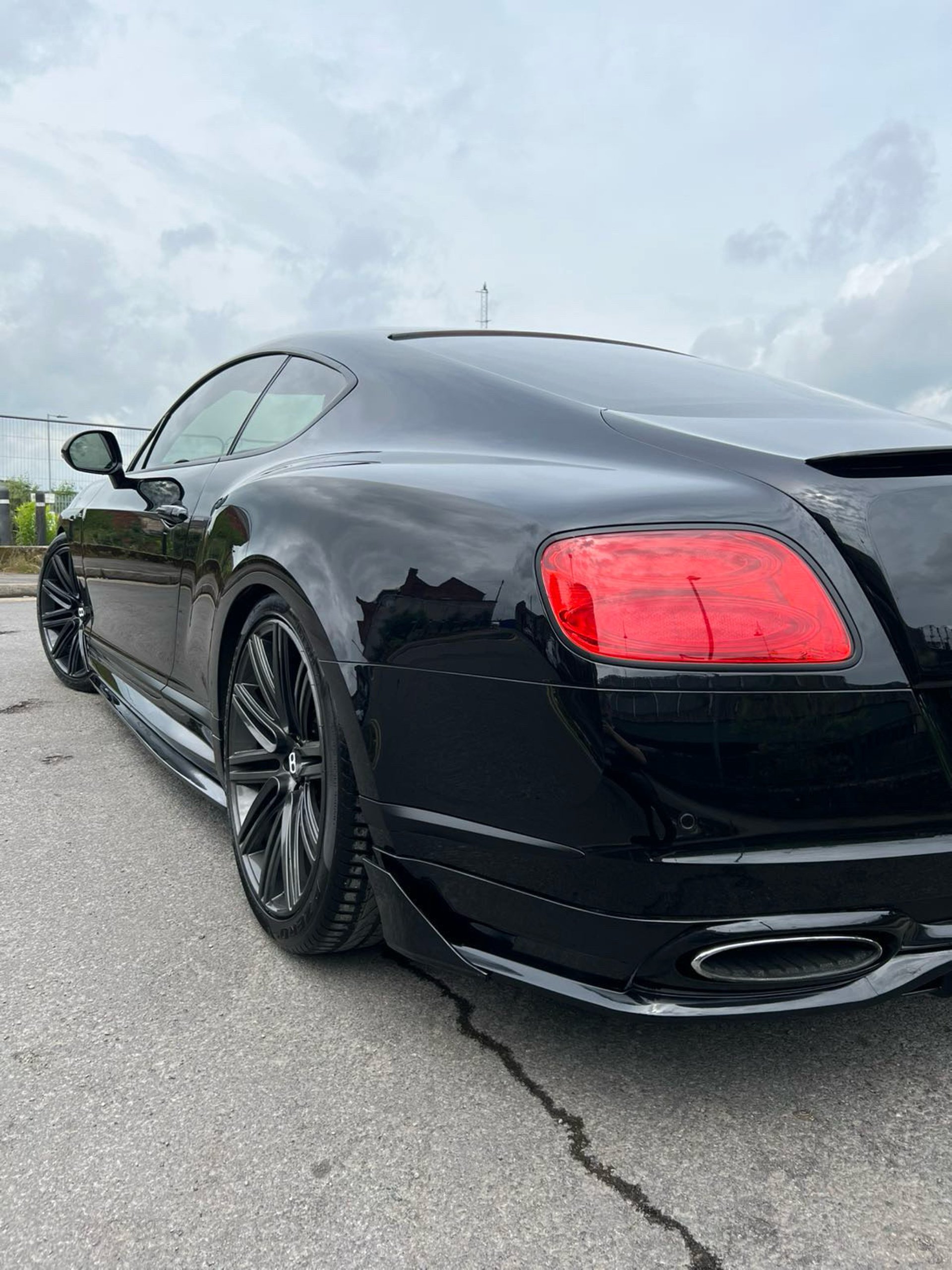 black and brown leather padded tub sofa