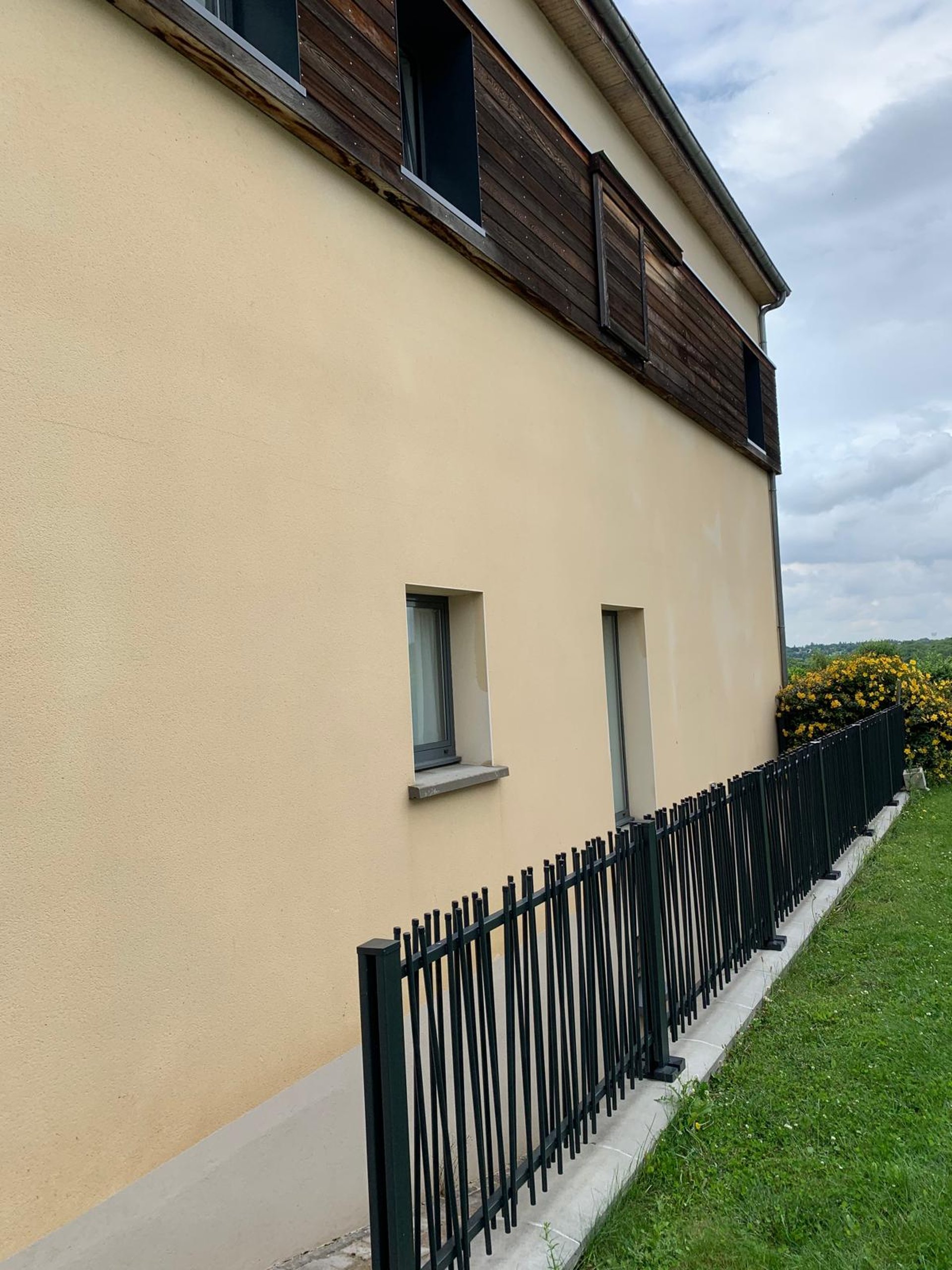 a man on a roof working with a rope