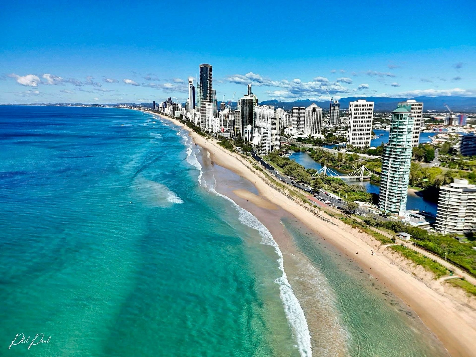 aerial view of city buildings near sea during daytime