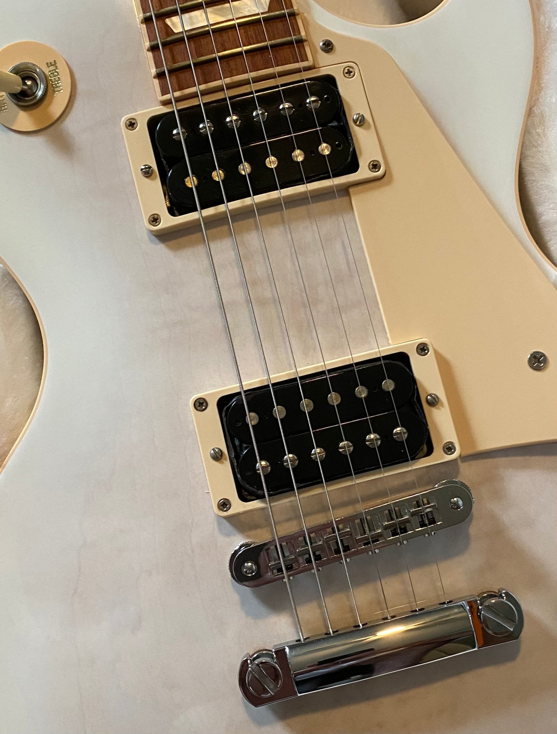an abstract photo of a curved building with a blue sky in the background