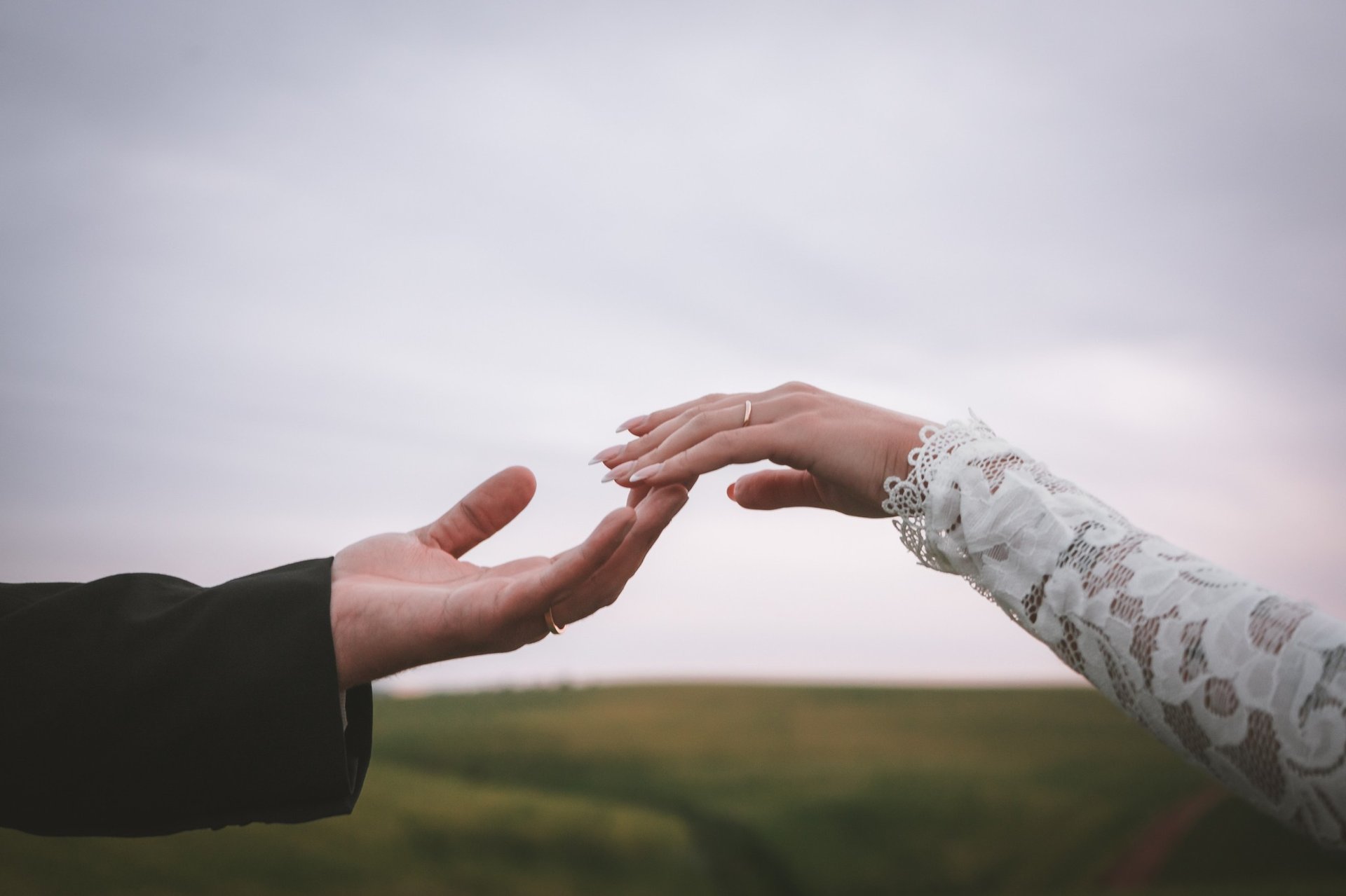 an abstract photo of a curved building with a blue sky in the background