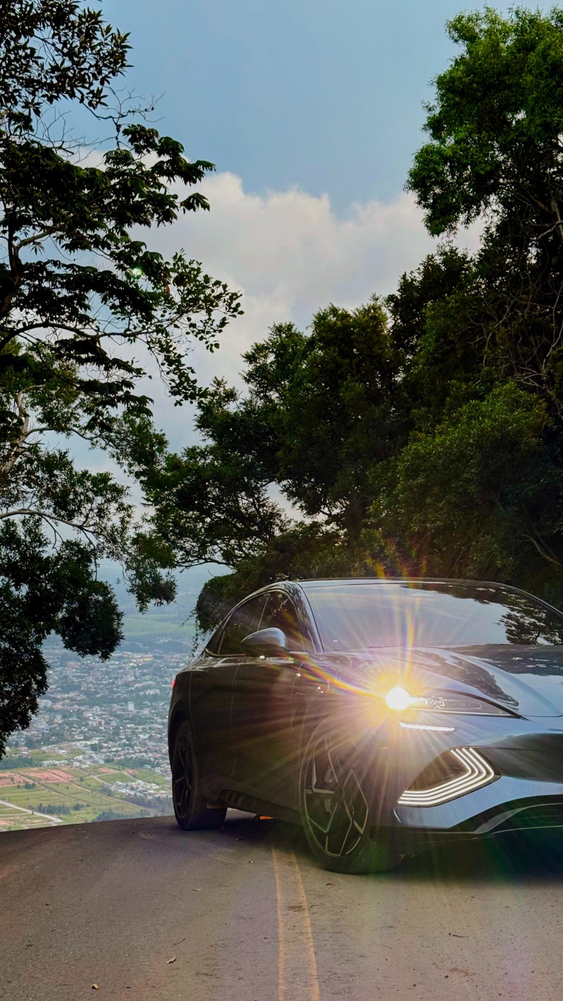 an abstract photo of a curved building with a blue sky in the background