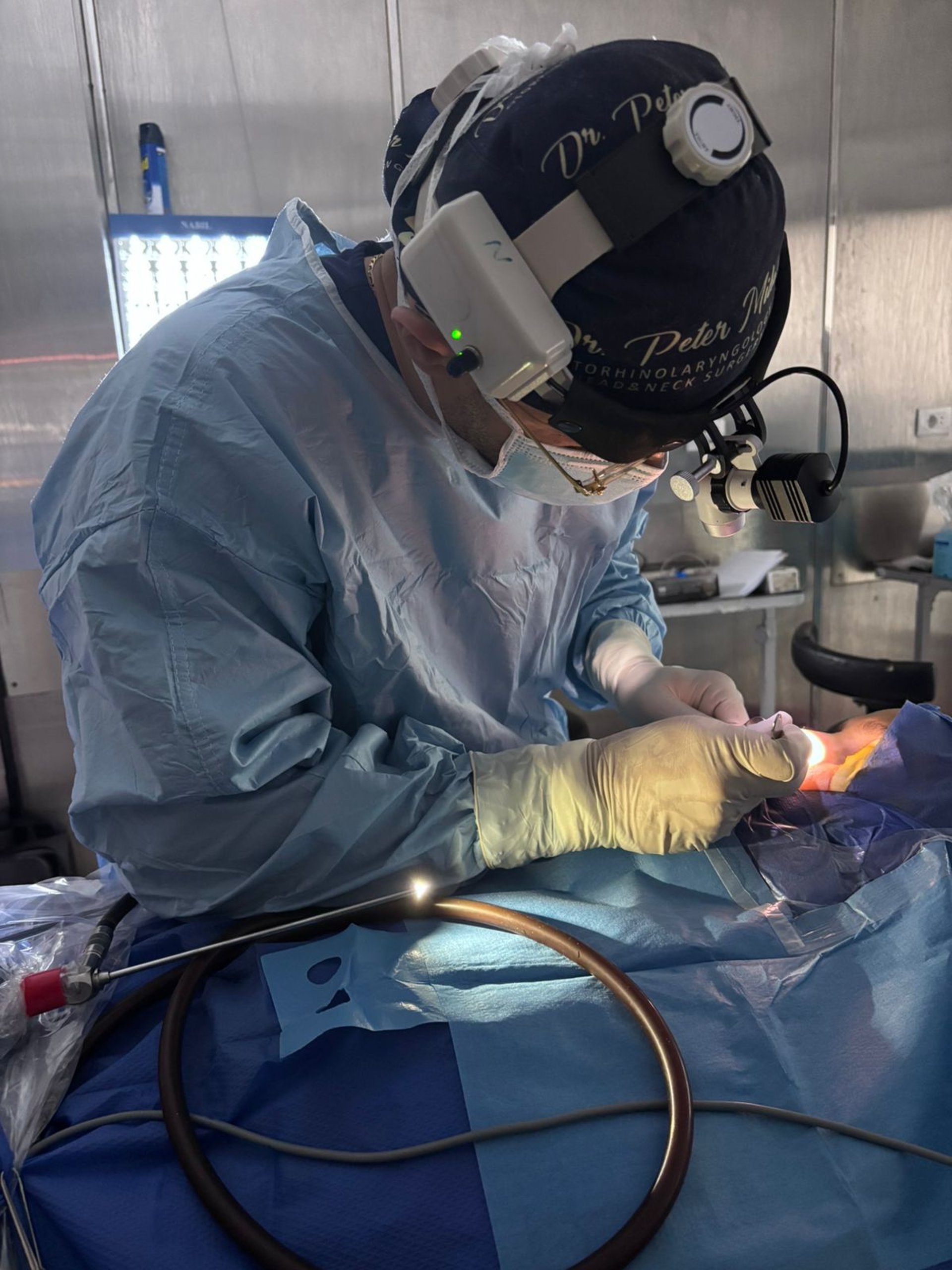 two surgeons performing surgery on a patient in a hospital