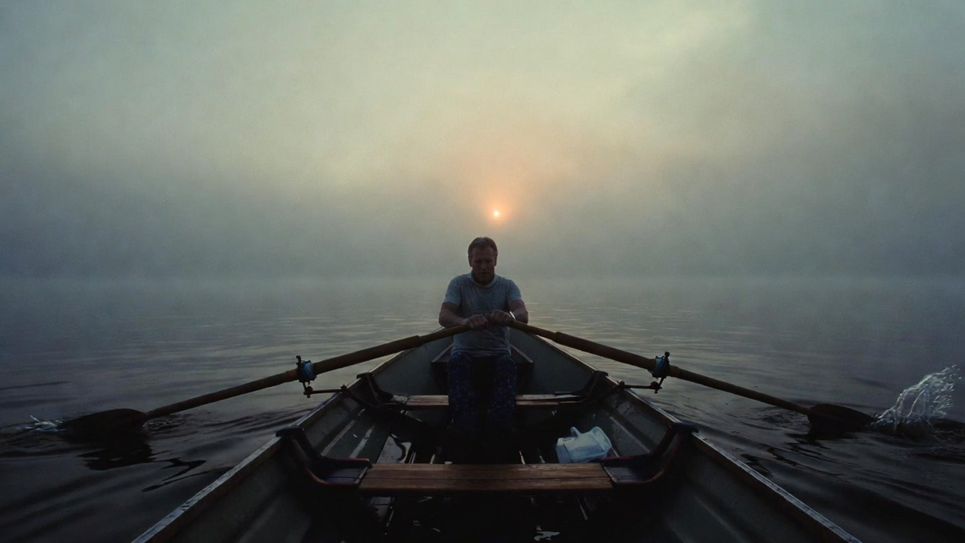 an abstract photo of a curved building with a blue sky in the background