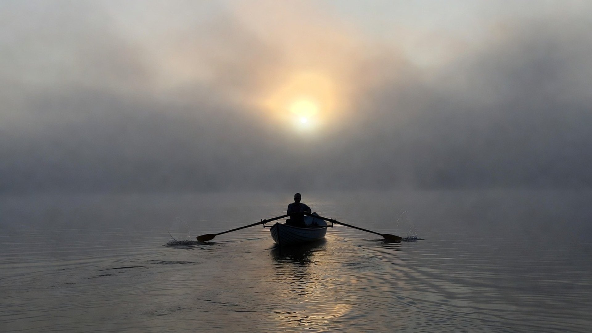 an abstract photo of a curved building with a blue sky in the background