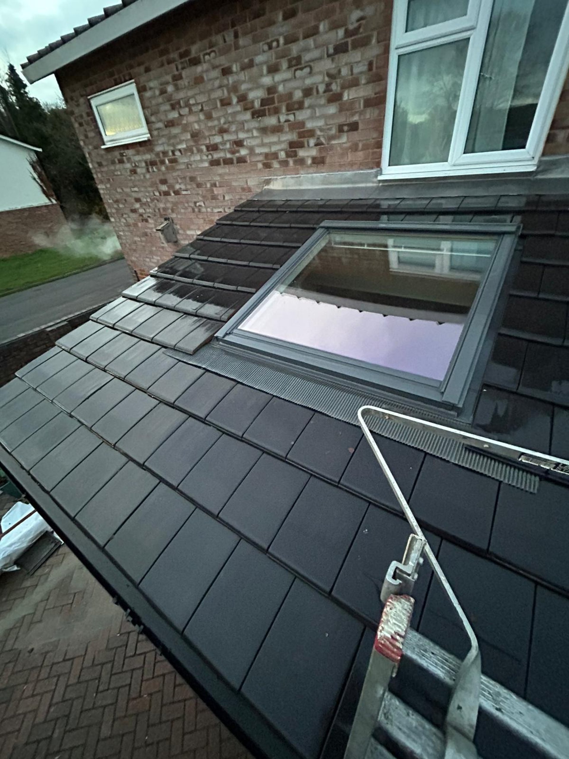 black and brown leather padded tub sofa
