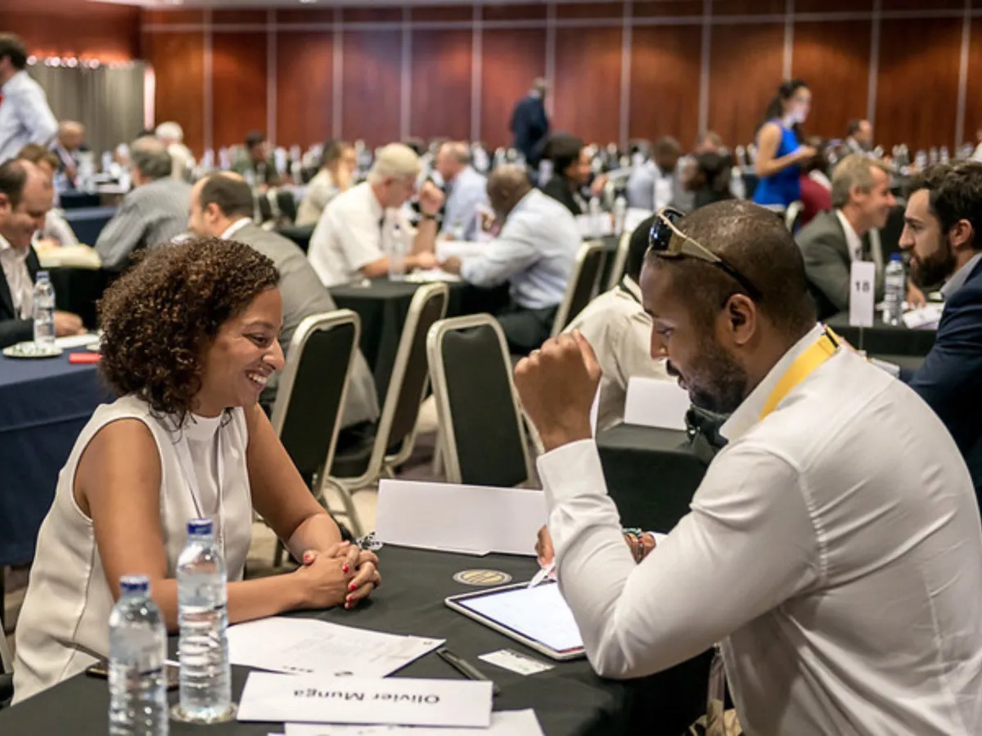 an abstract photo of a curved building with a blue sky in the background