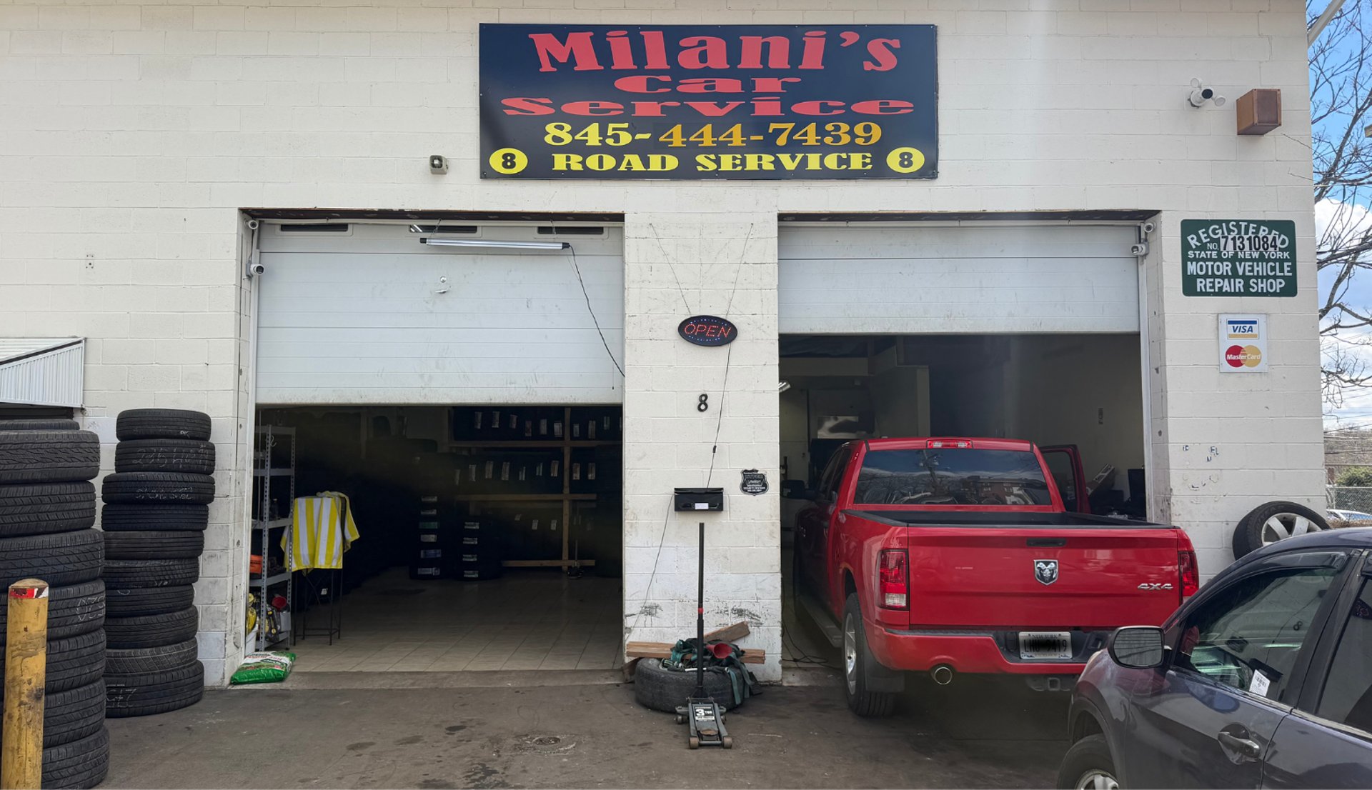 Modern bathroom with glass-enclosed shower and marble walls