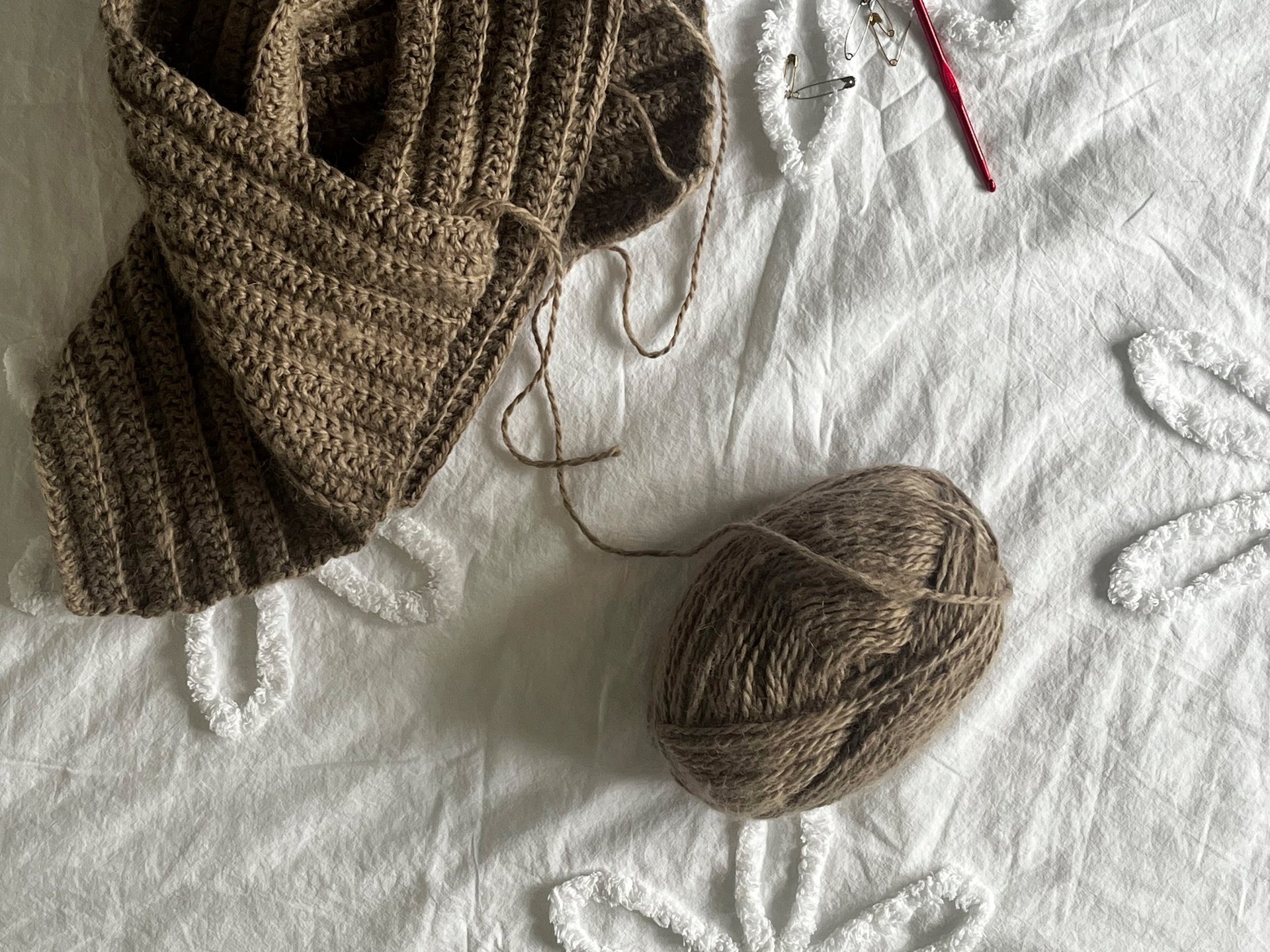 person wearing grey knit sweater