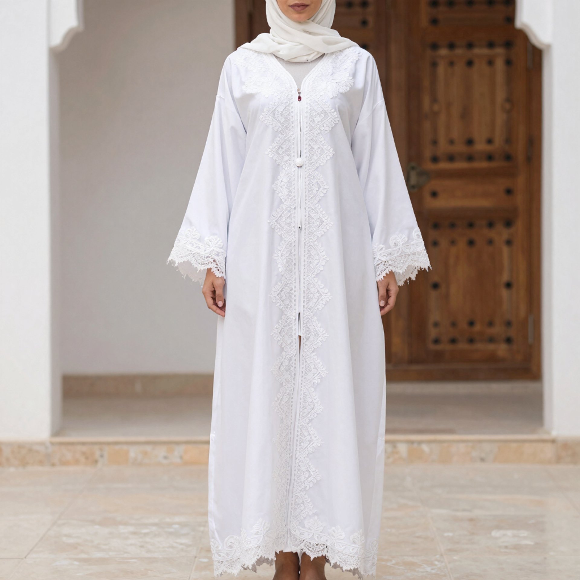 a woman sitting on a bench in a long dress