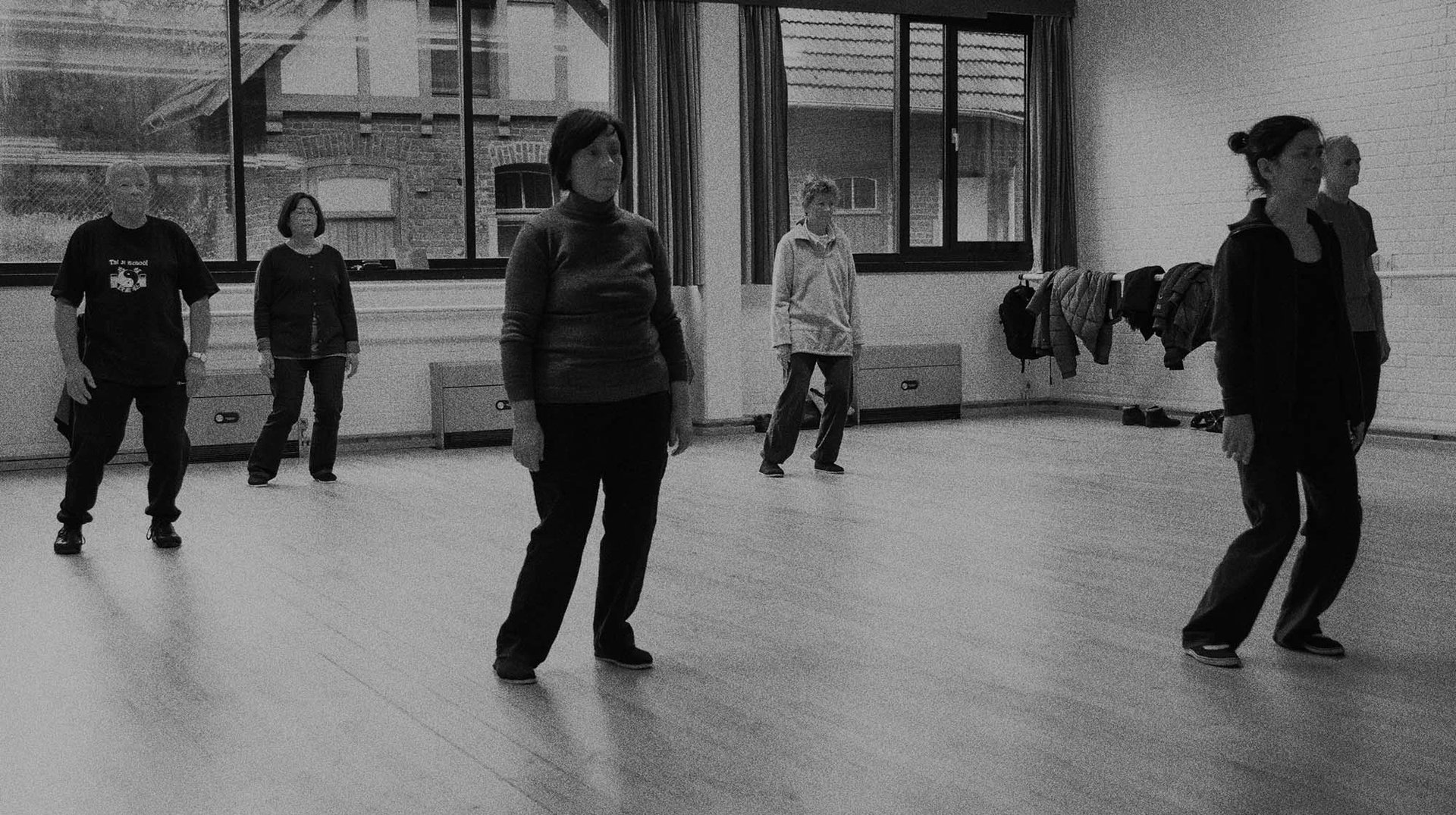an abstract photo of a curved building with a blue sky in the background