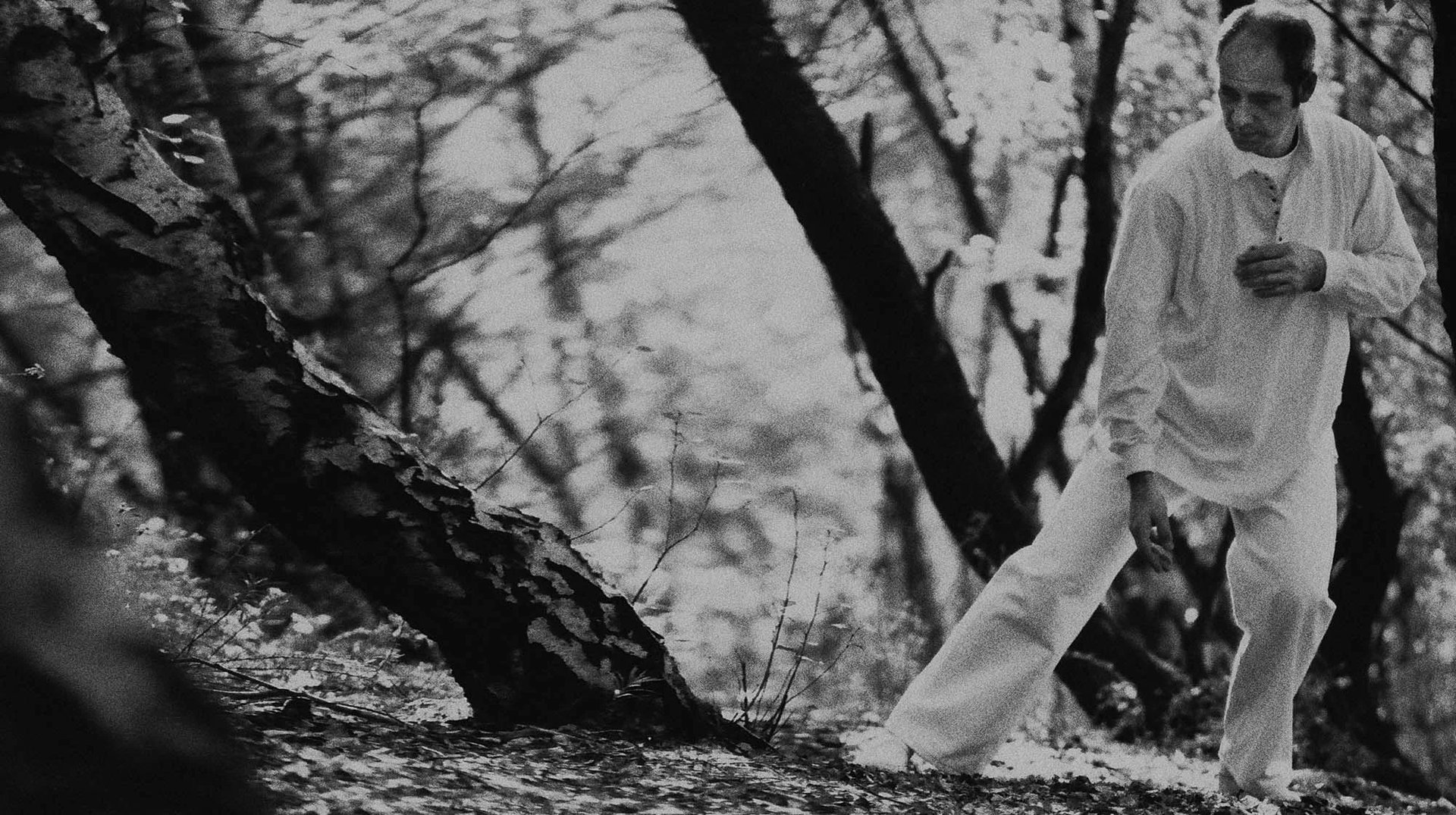 an abstract photo of a curved building with a blue sky in the background